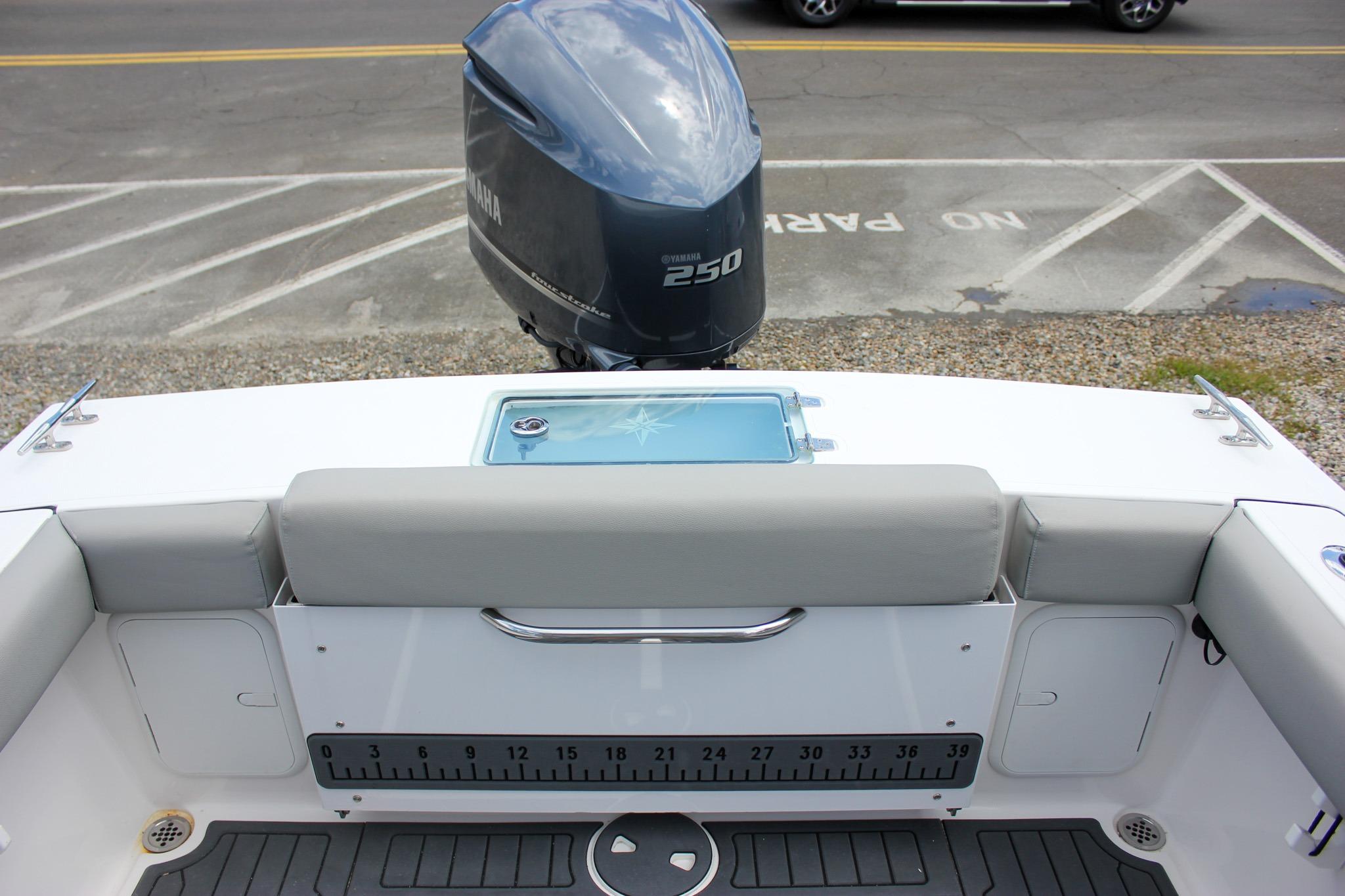 2022 NorthCoast 235 Cabin boat with Yamaha 250 engine, featuring a spacious rear seating area.
