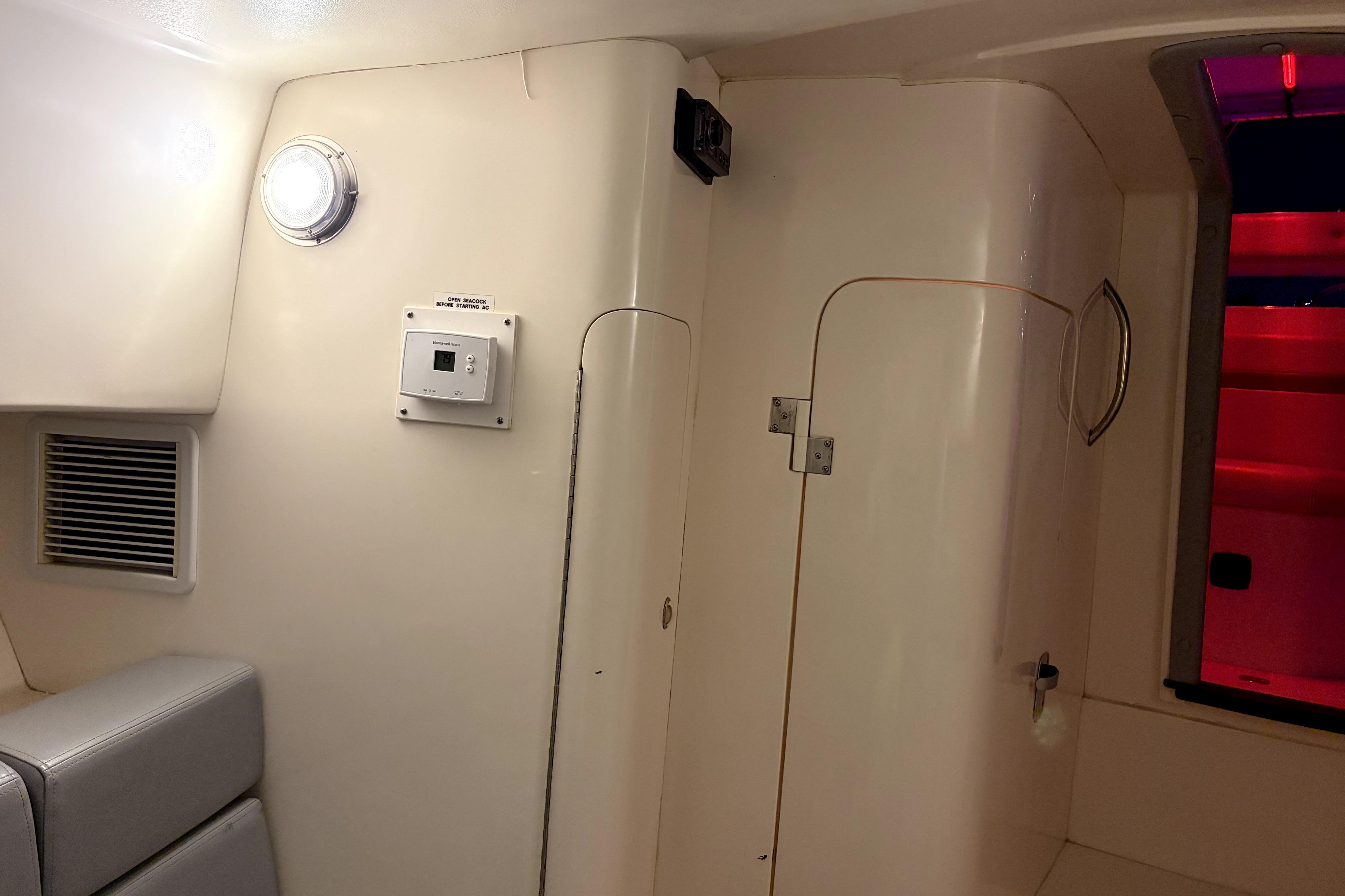 Interior of a 1998 Intrepid 339 Walkaround boat, featuring a compact cabin space.