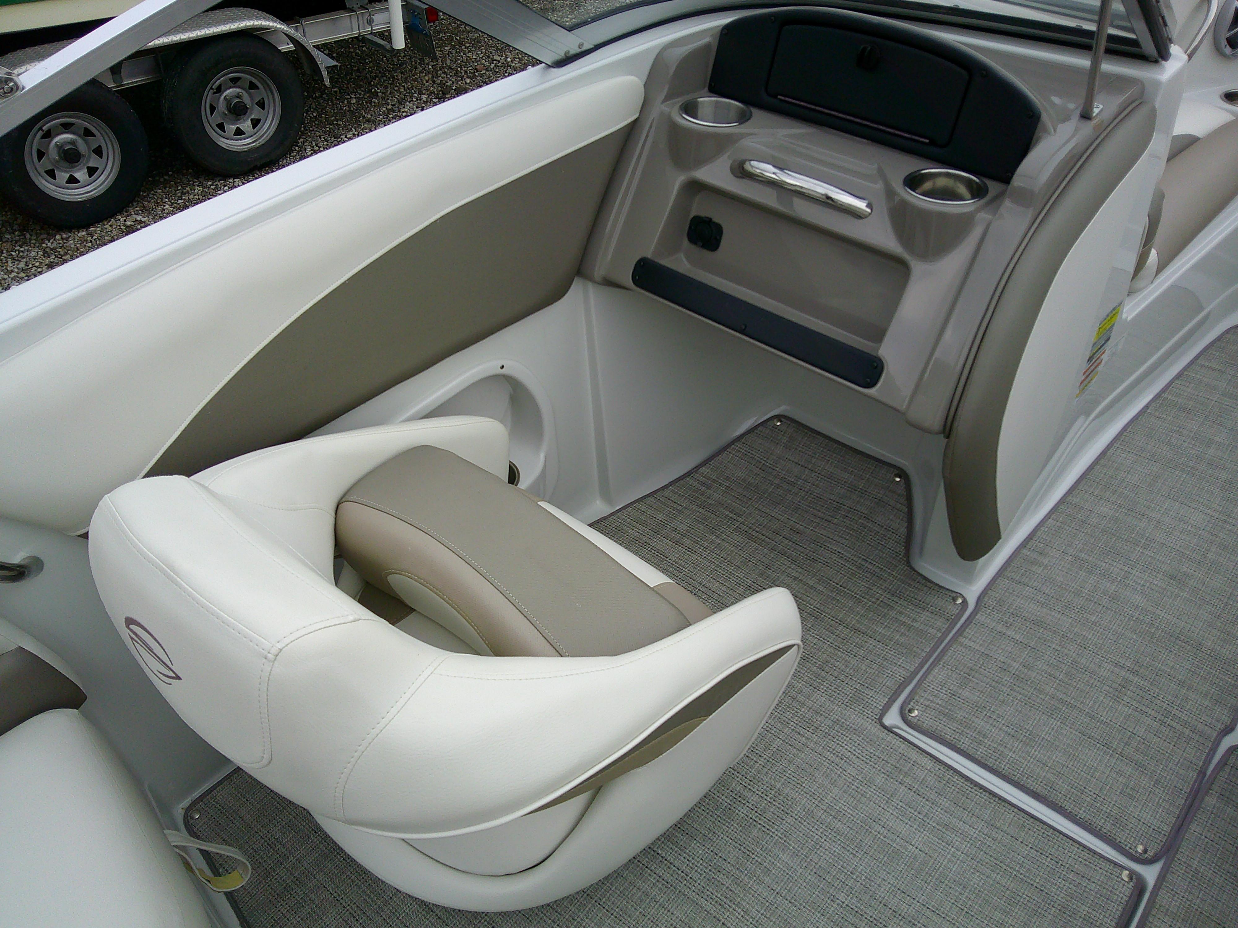 2019 Crownline 19 XS boat interior with beige seating and cup holders.