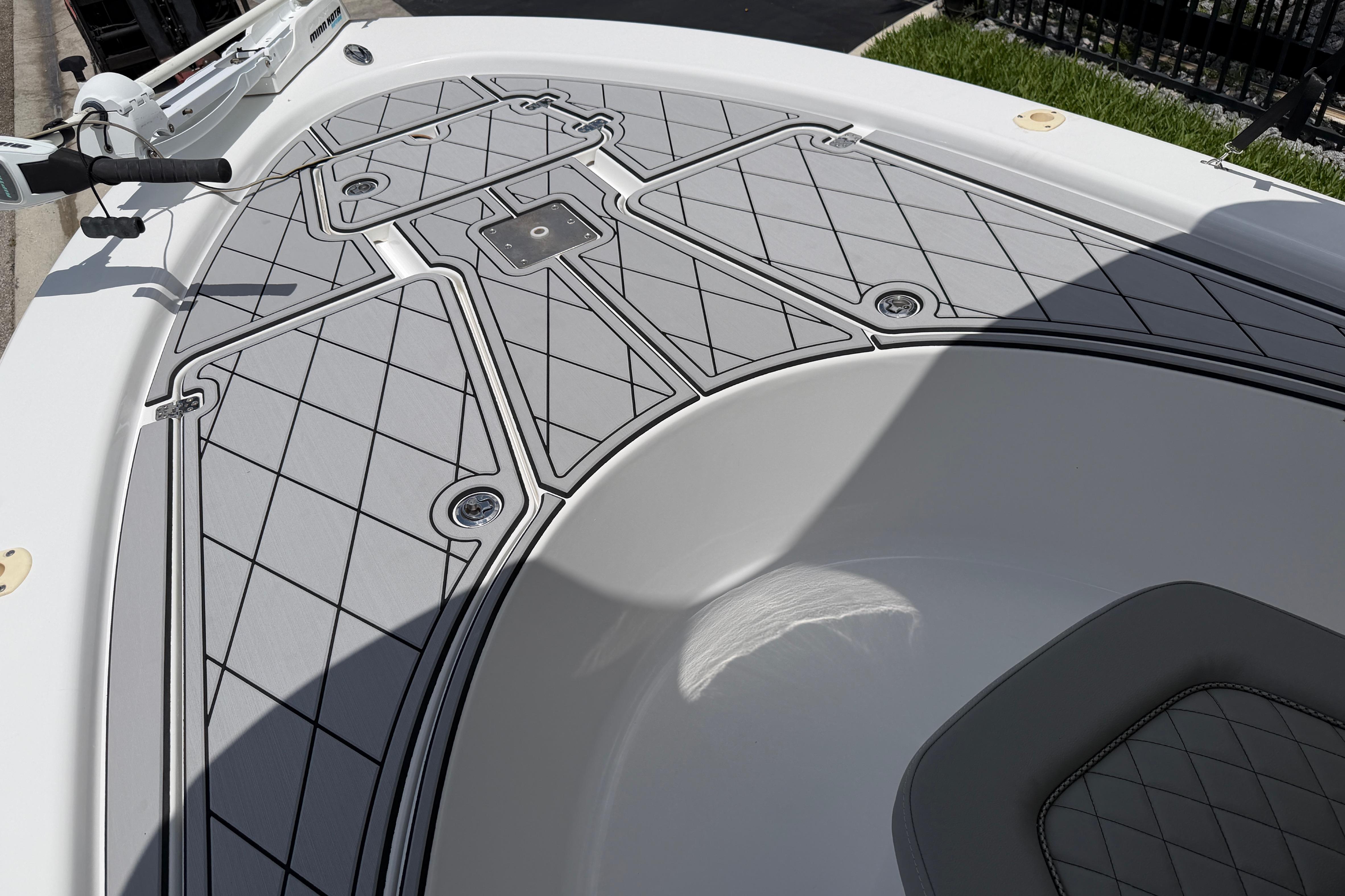 2015 Sportsman Masters 207 Bay Boat deck with gray diamond-patterned non-slip surface.