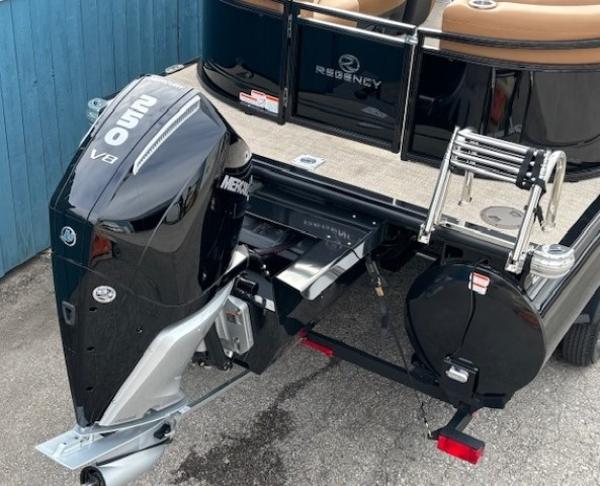 2025 Regency 230 LE3 boat with Mercury V8 outboard motor, rear view.