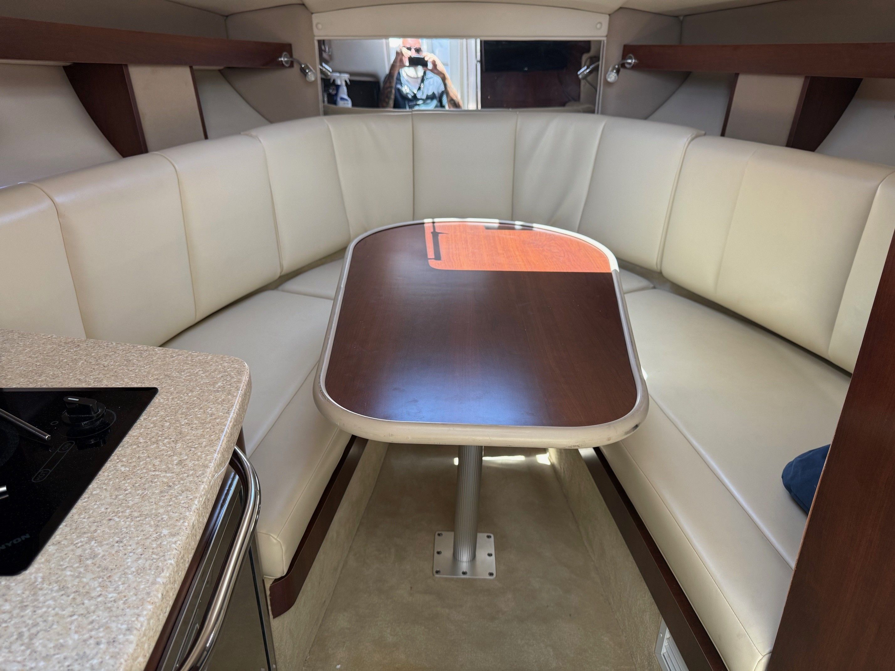 Interior of a 2018 Chaparral 270 Signature with dining table.