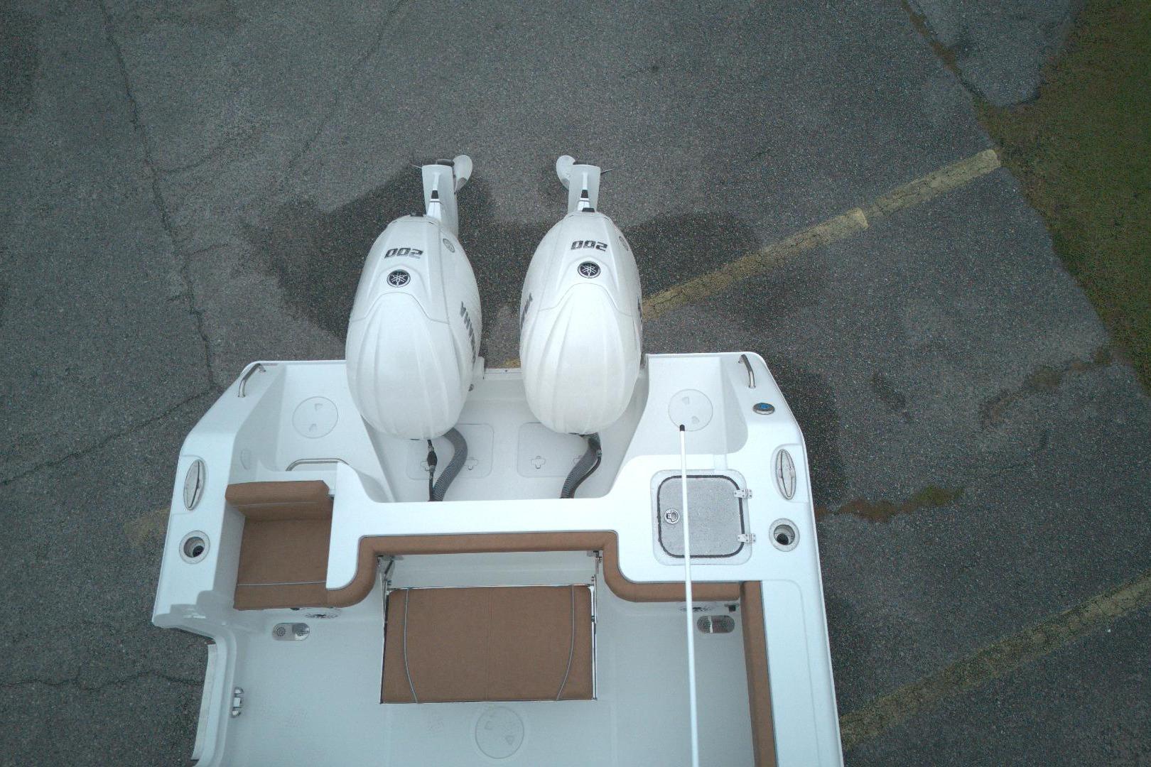 Overhead view of 2026 Sea Hunt Gamefish 25 with twin outboard engines.
