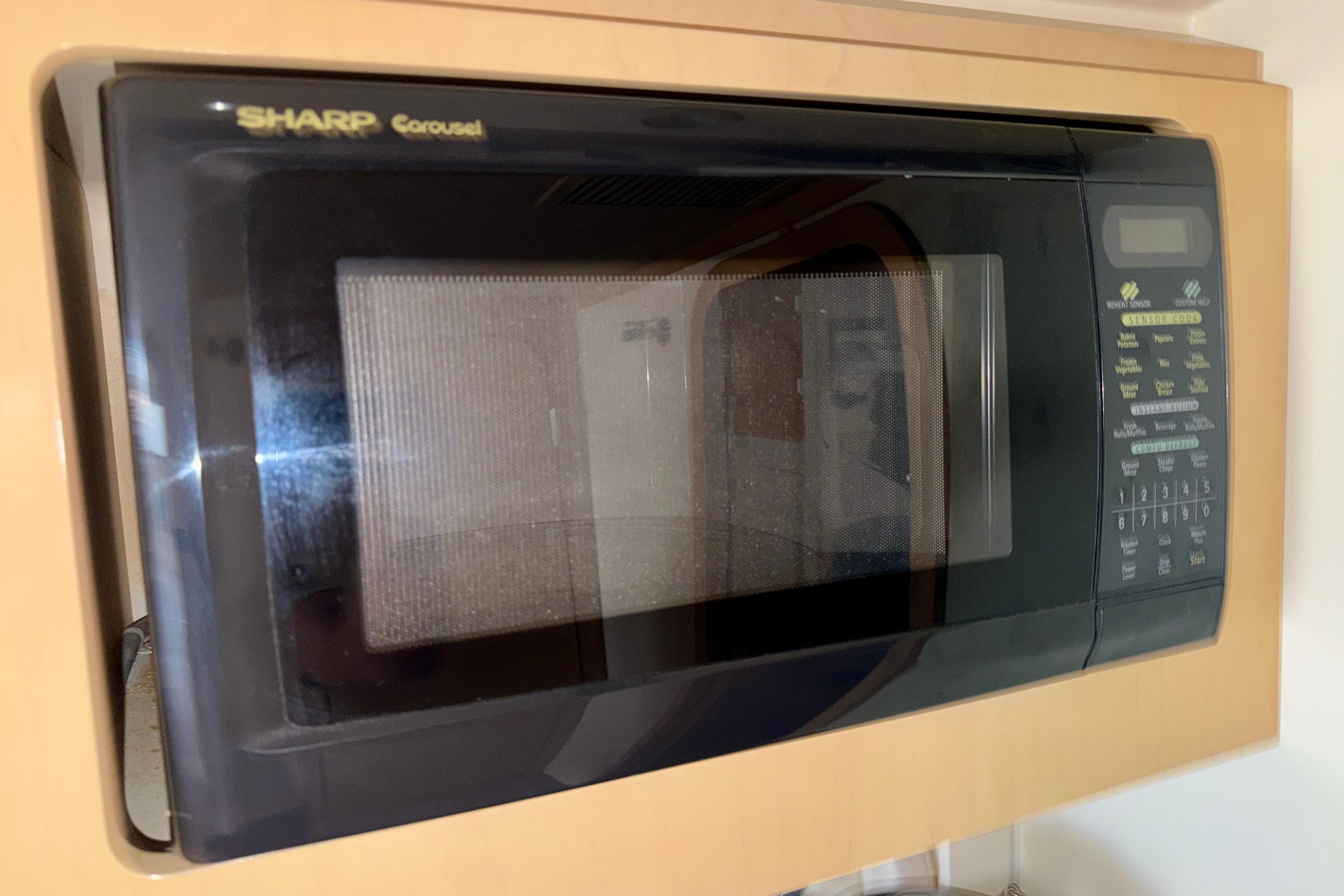 Sharp Carousel microwave in a 2000 Carver 350 Mariner yacht kitchen.