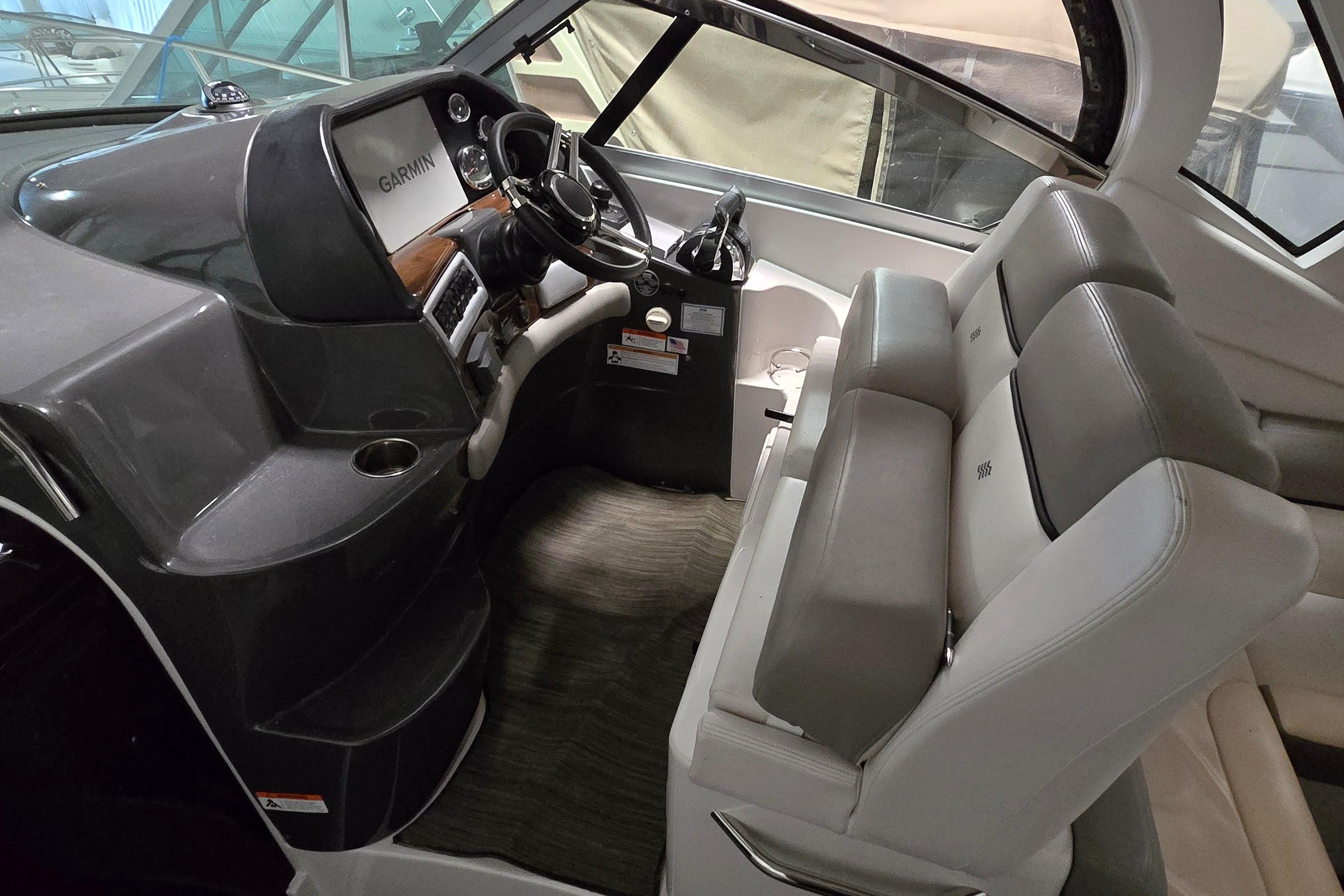 Interior cockpit of 2018 Four Winns V355 boat with Garmin navigation system.