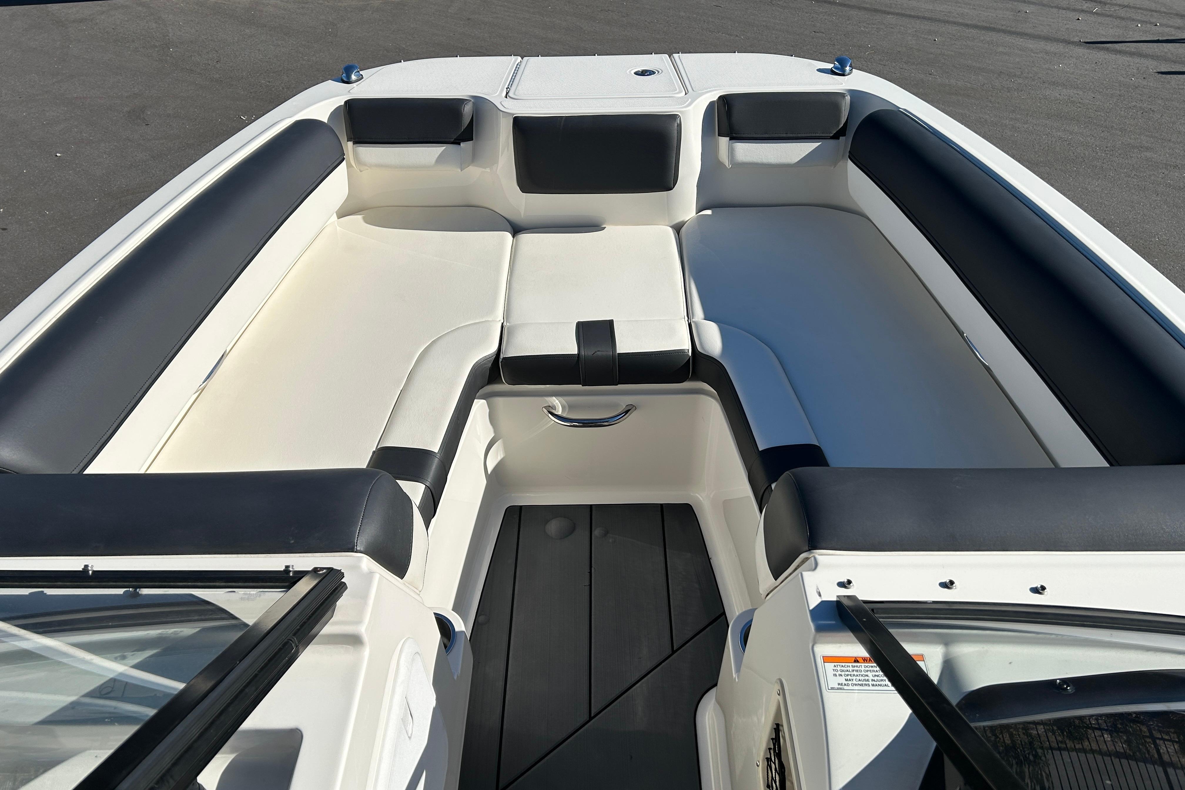 2020 Bayliner DX 2000 boat interior with white and black seating.