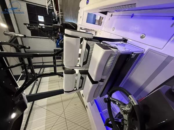 2025 Blackfin 272CC boat interior with modern seating and steering wheel.