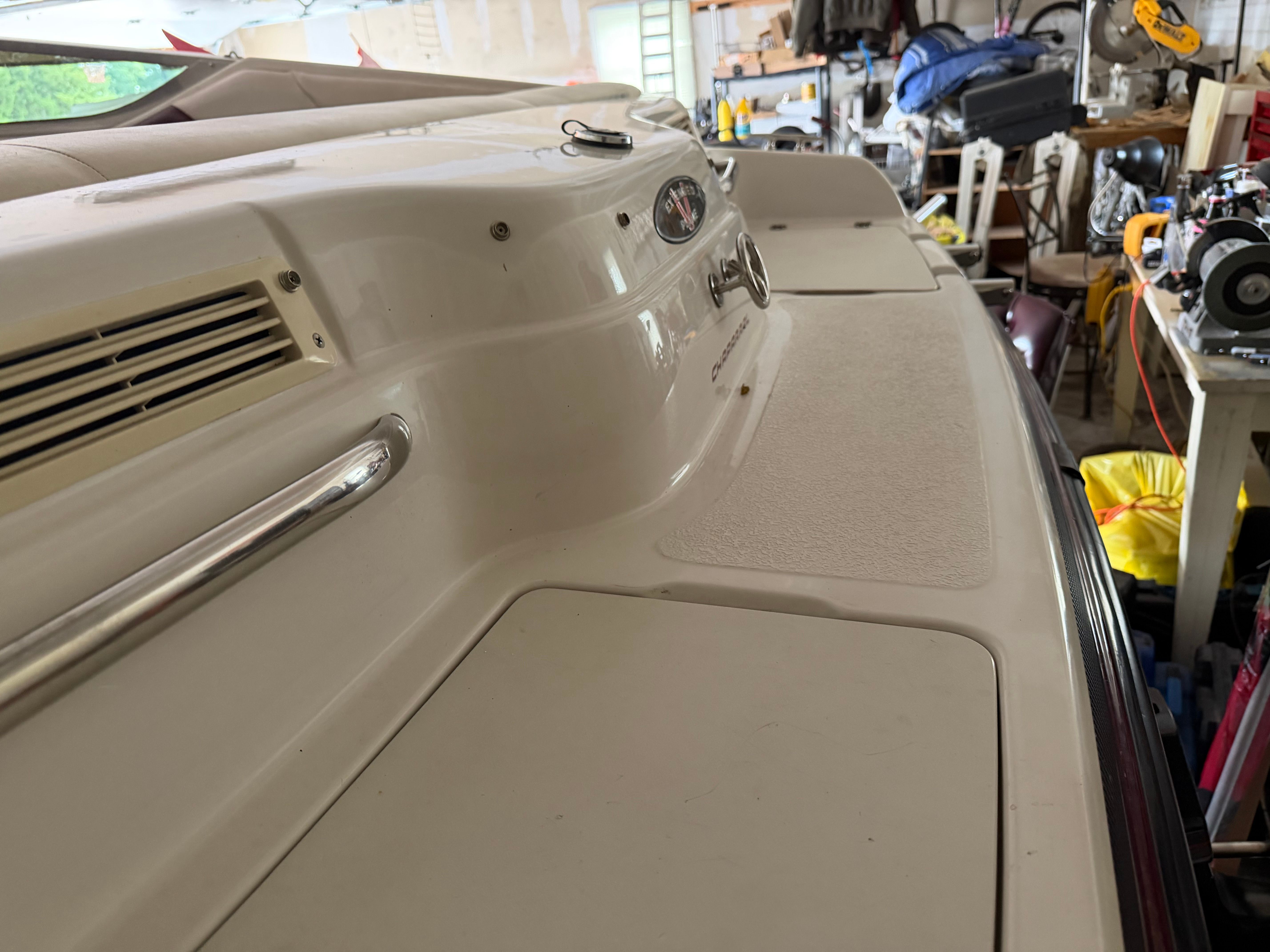 The image shows the deck of a 1994 Chaparral 1930 boat in a garage.