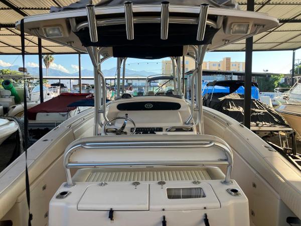 2006 Grady-White Bimini 306 boat in marina, featuring sleek design and spacious deck.