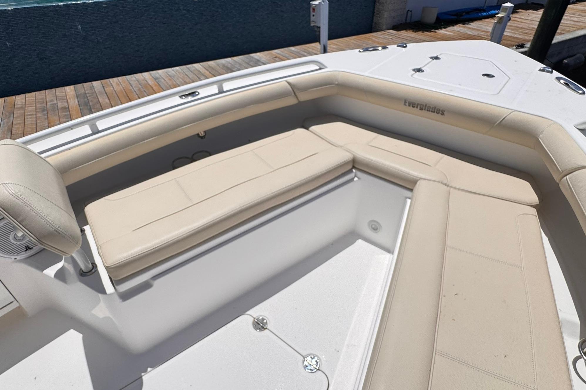 2018 Everglades 253 Center Console boat with beige seating and spacious deck area.