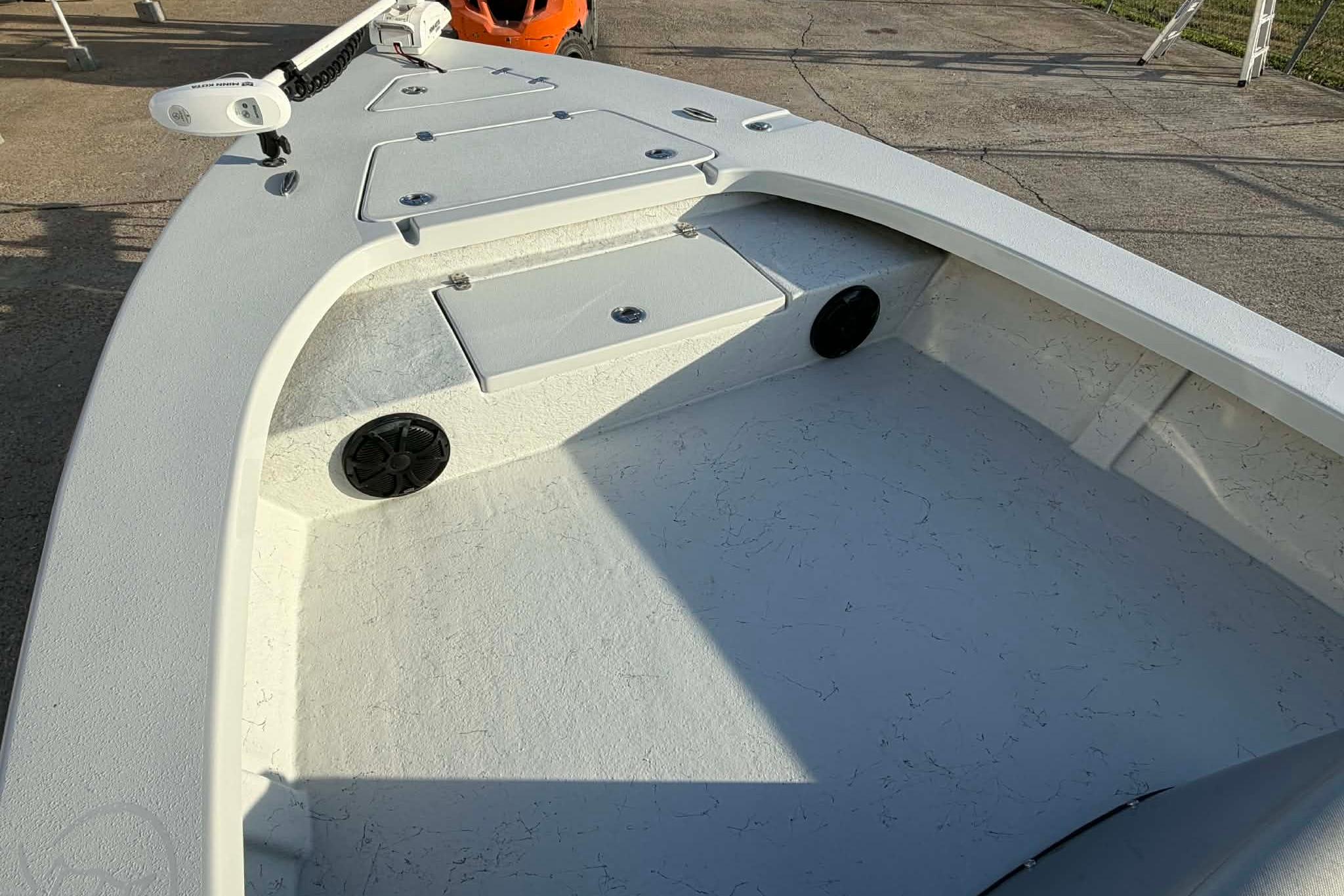 2021 Blazer Bay 2420 boat interior with storage compartments and speakers.