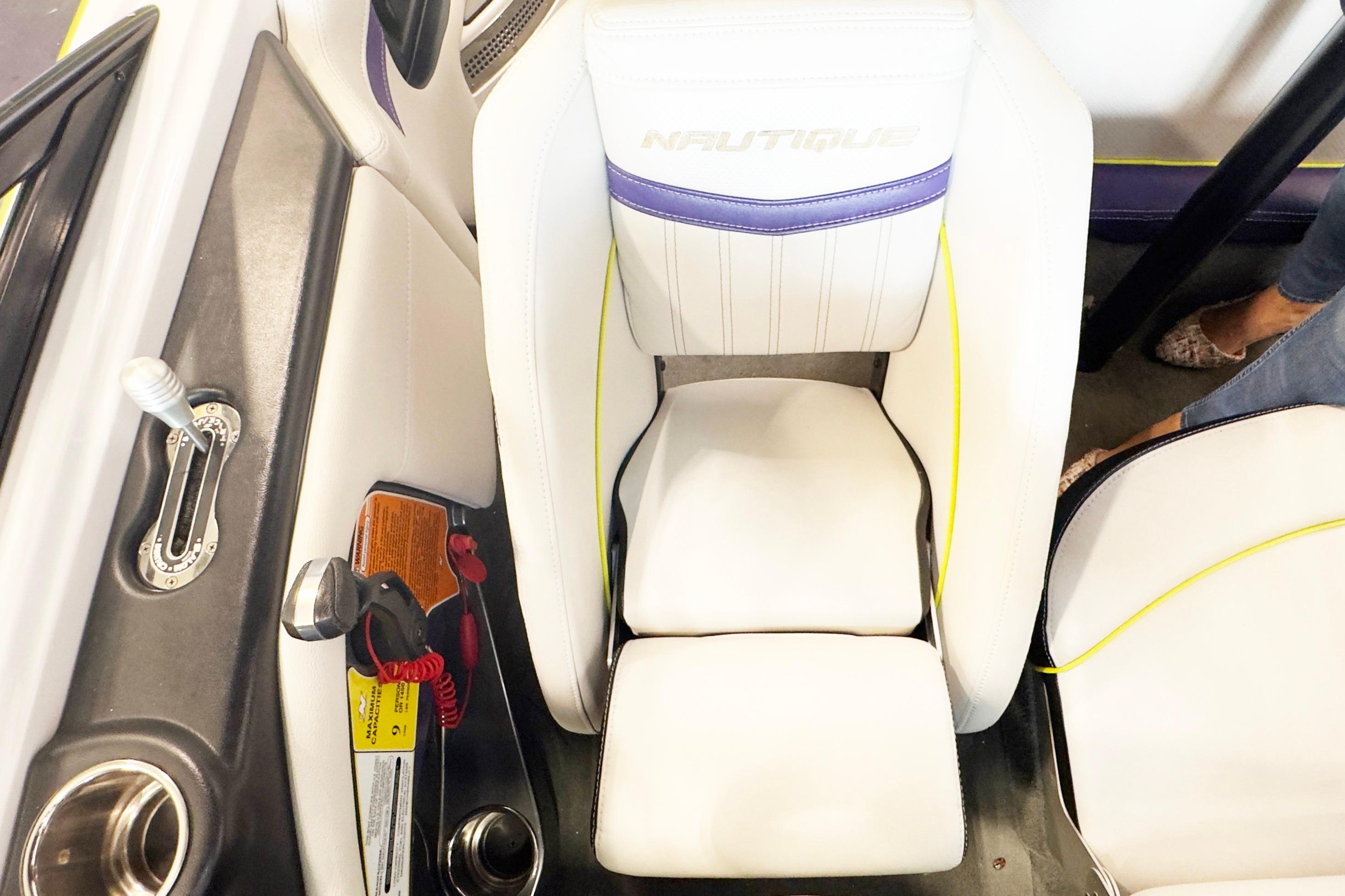 2014 Nautique Ski Nautique 200 Closed Bow interior with white seating and control panel.