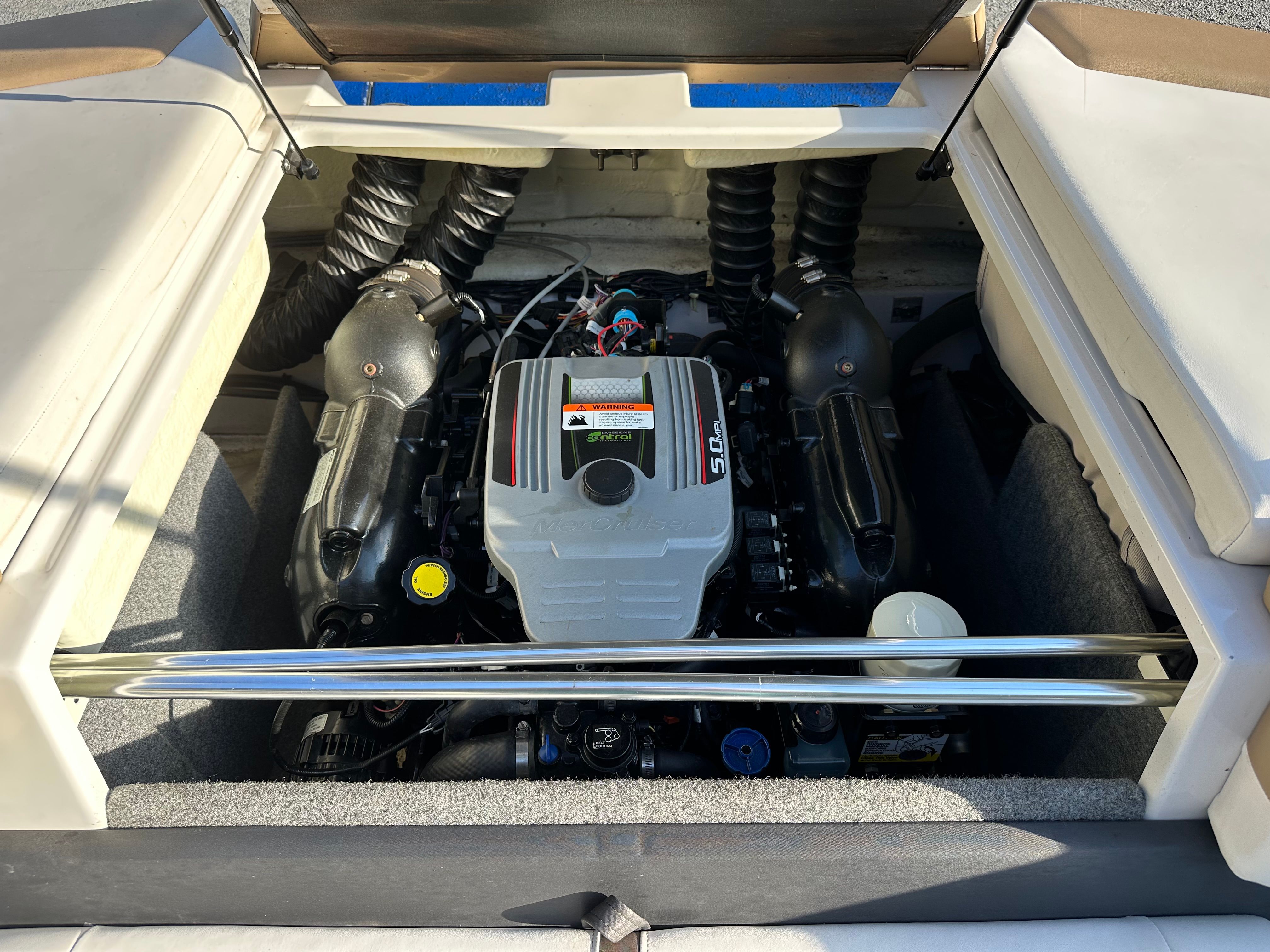 Engine compartment of 2012 Four Winns H210 boat.
