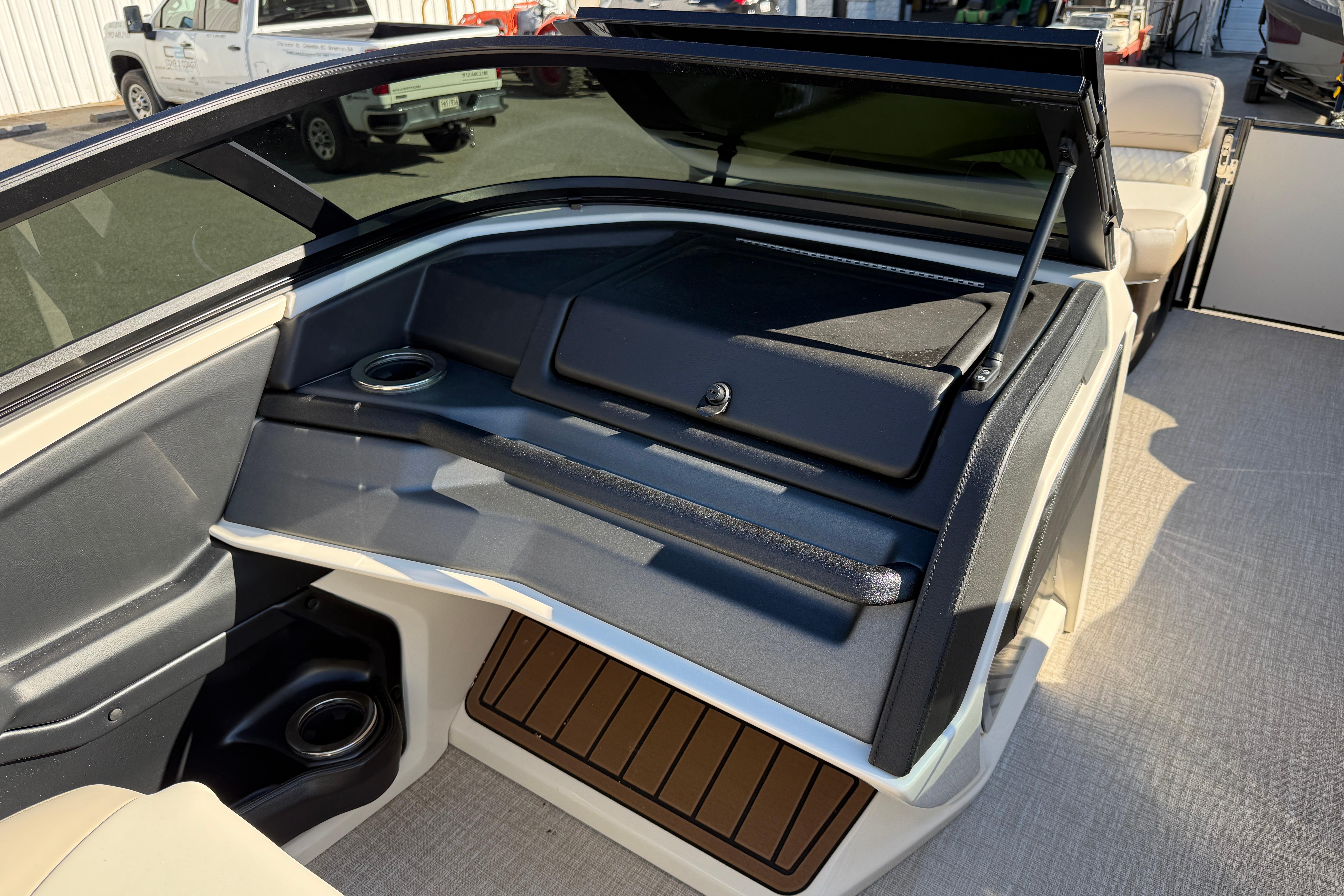 2026 Tahoe Pontoon Cascade Quad Lounger Windshield interior with seating and storage compartments.