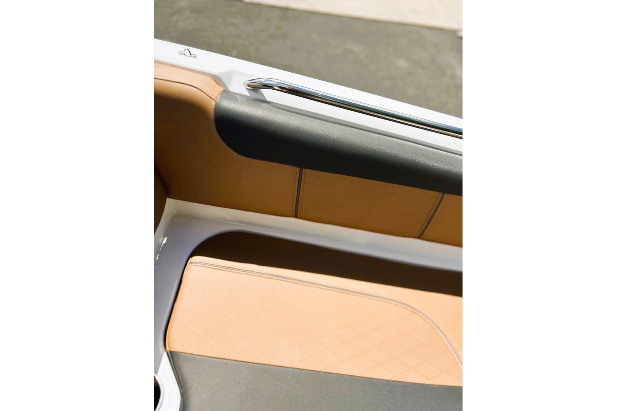 Interior detail of 2026 Tahoe 2150 boat, featuring tan and black seating.