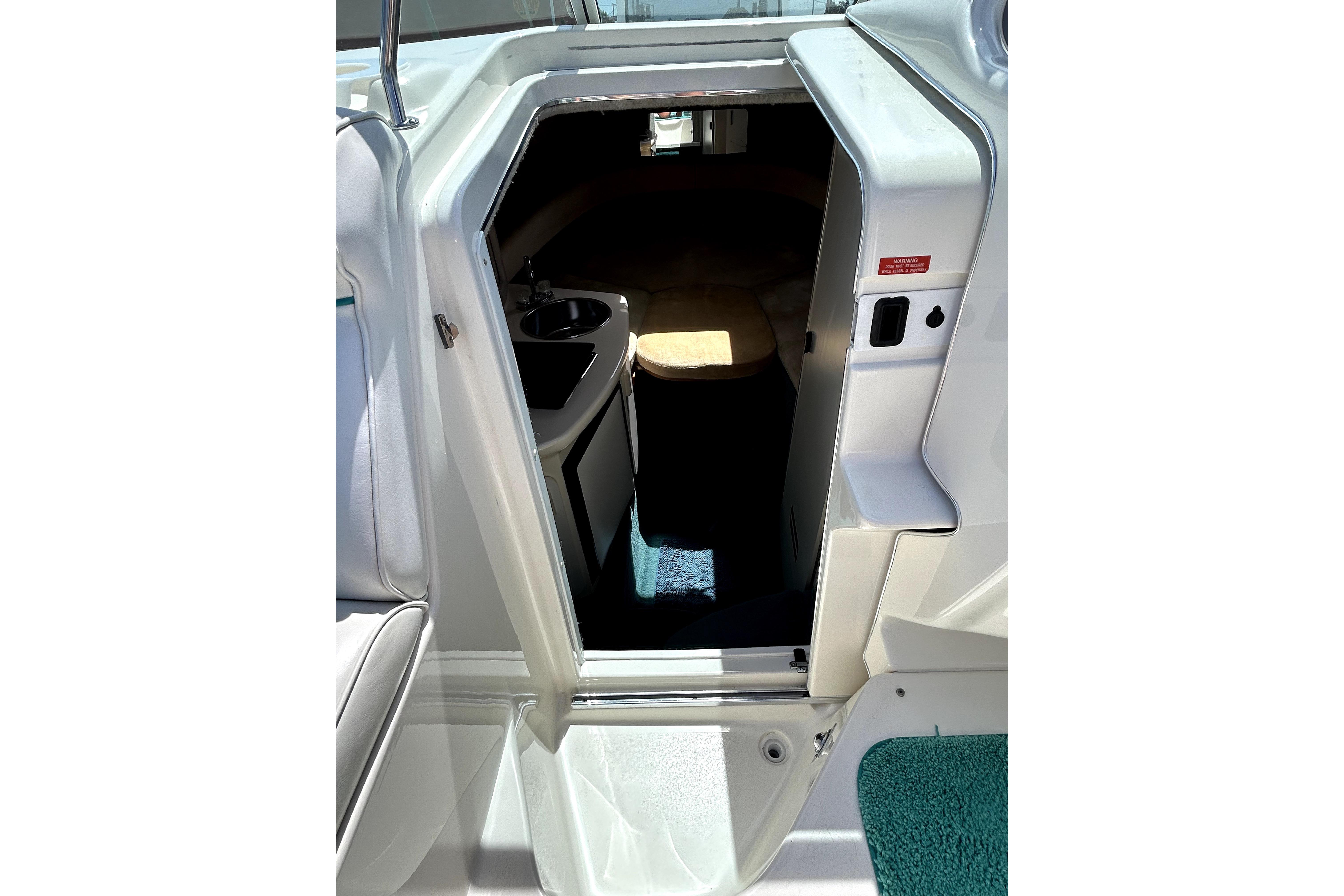 1995 Sea Ray 250 Sundancer cabin entrance with interior view.