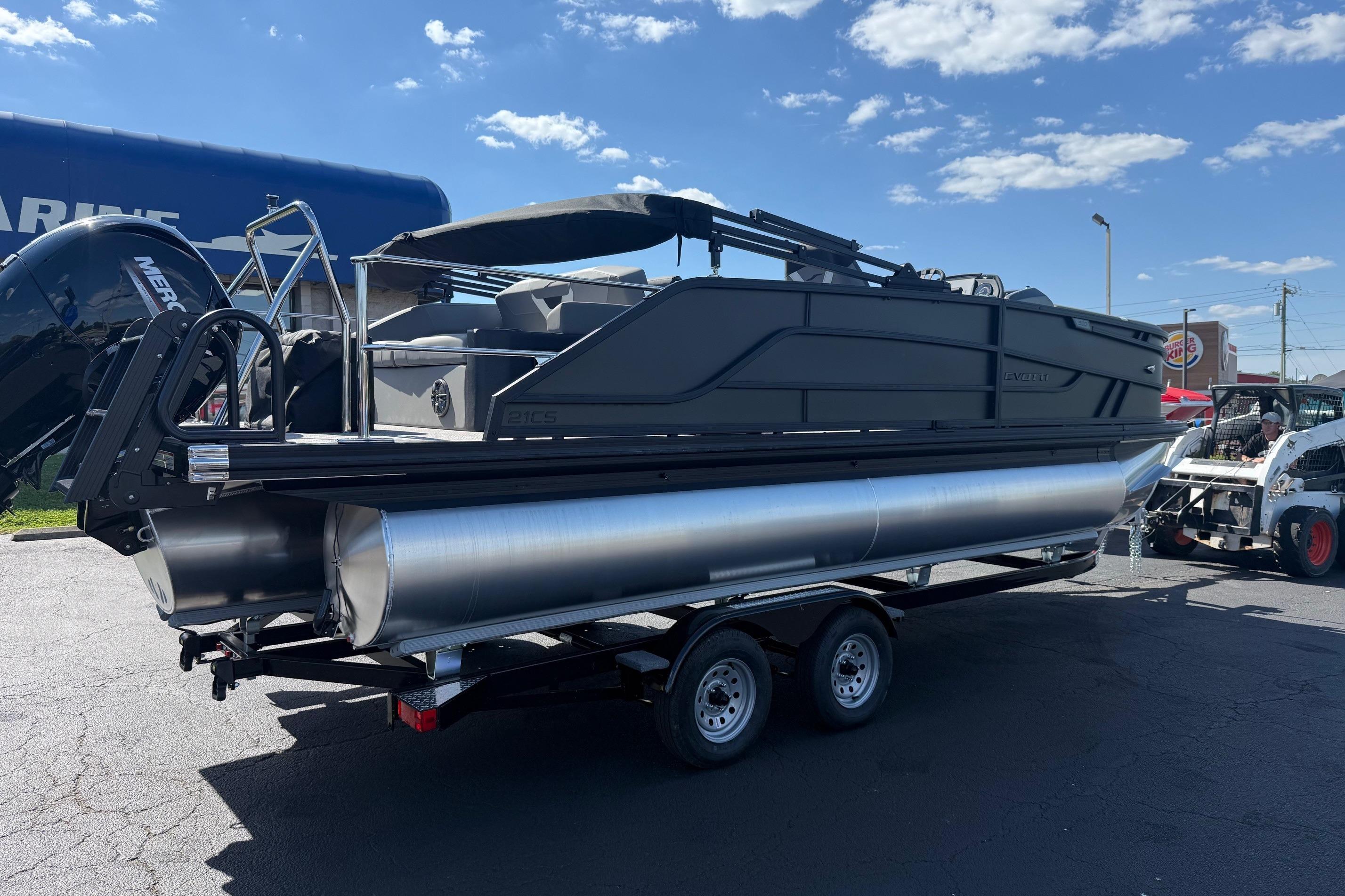 2026 Evotti 521CS pontoon boat on trailer under clear blue sky.