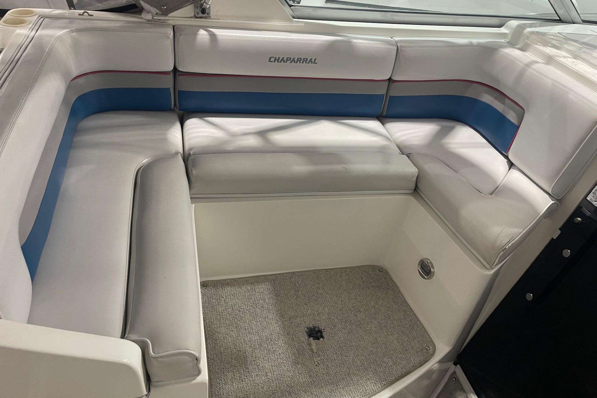 1992 Chaparral Signature 30 boat interior with white and blue cushioned seating.