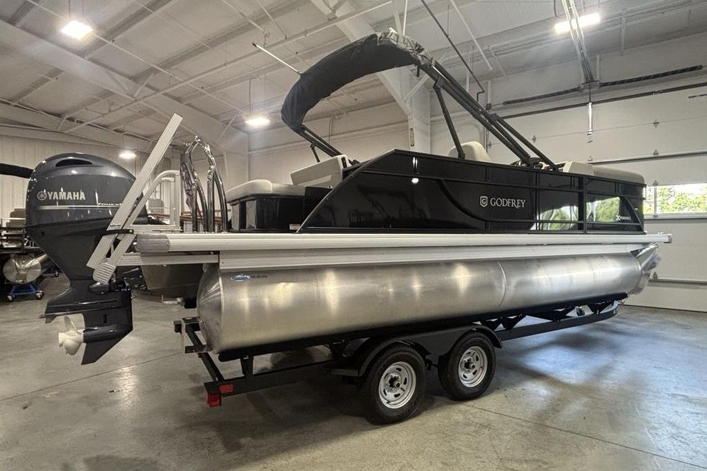 2026 Godfrey Xperience 2086 SFLX pontoon boat with Yamaha engine in showroom.