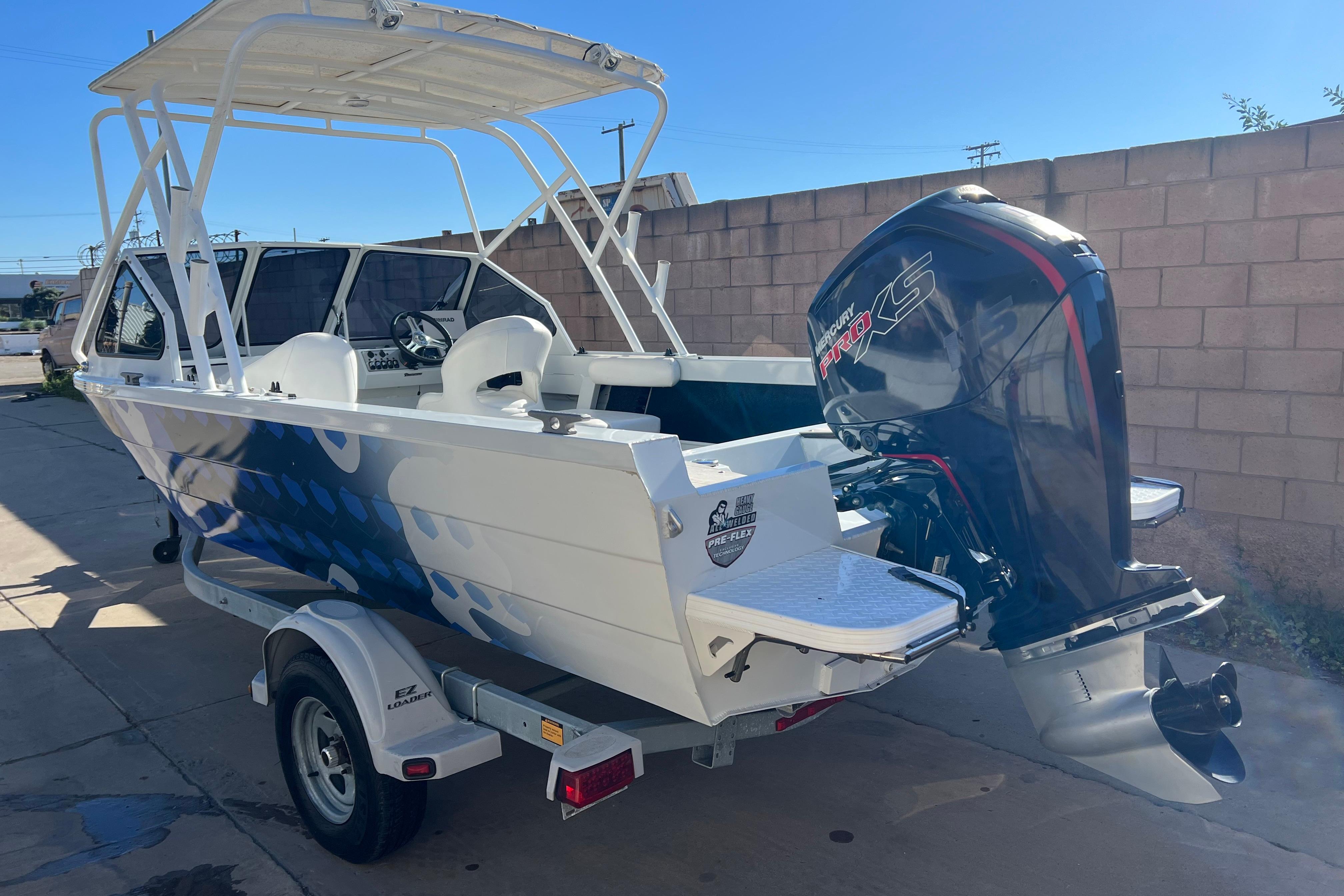 2019 KingFisher 1825 Falcon boat with Mercury Pro XS engine on trailer.
