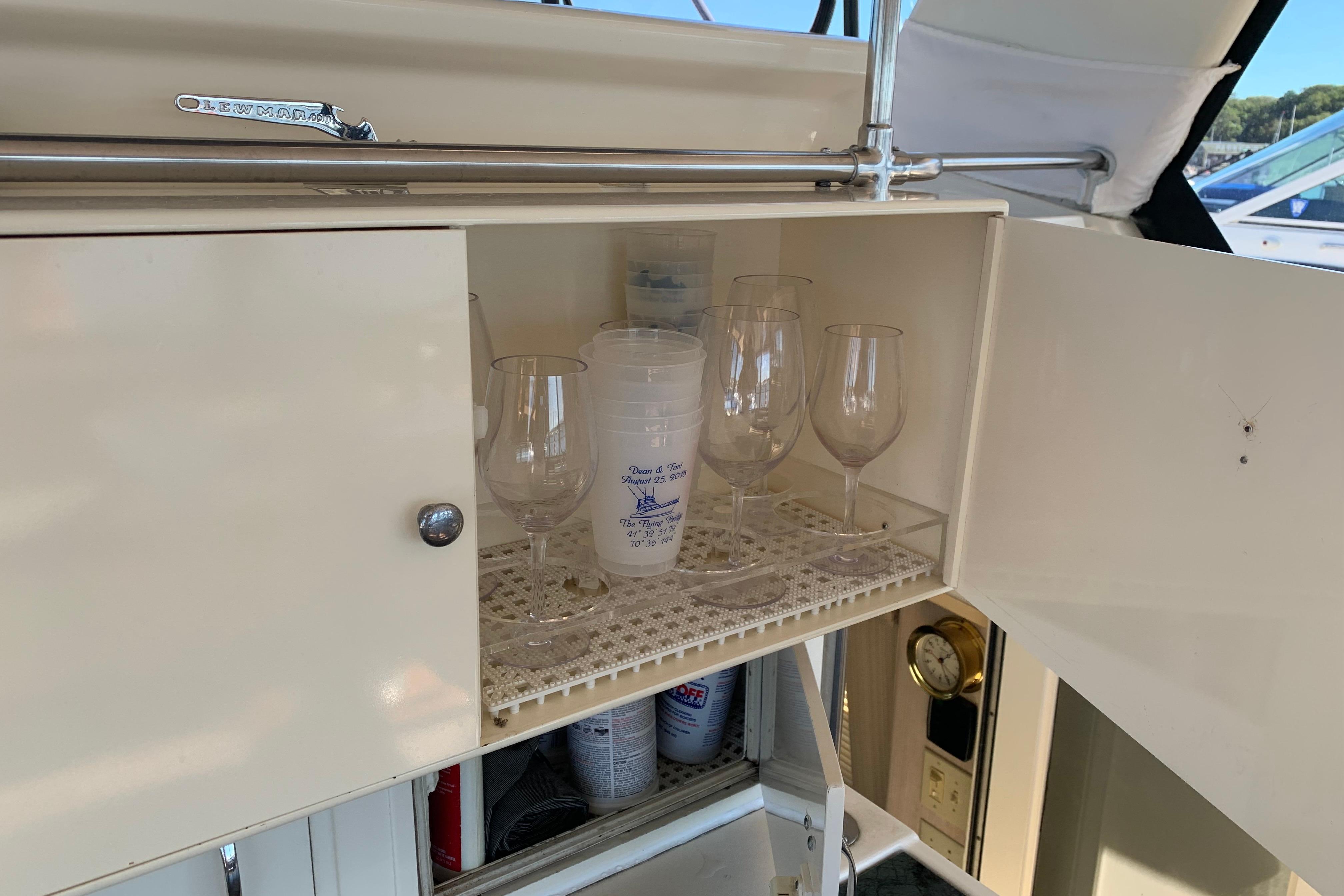 Cabinet with glasses and cups on 1991 Hatteras 40 Motor Yacht.