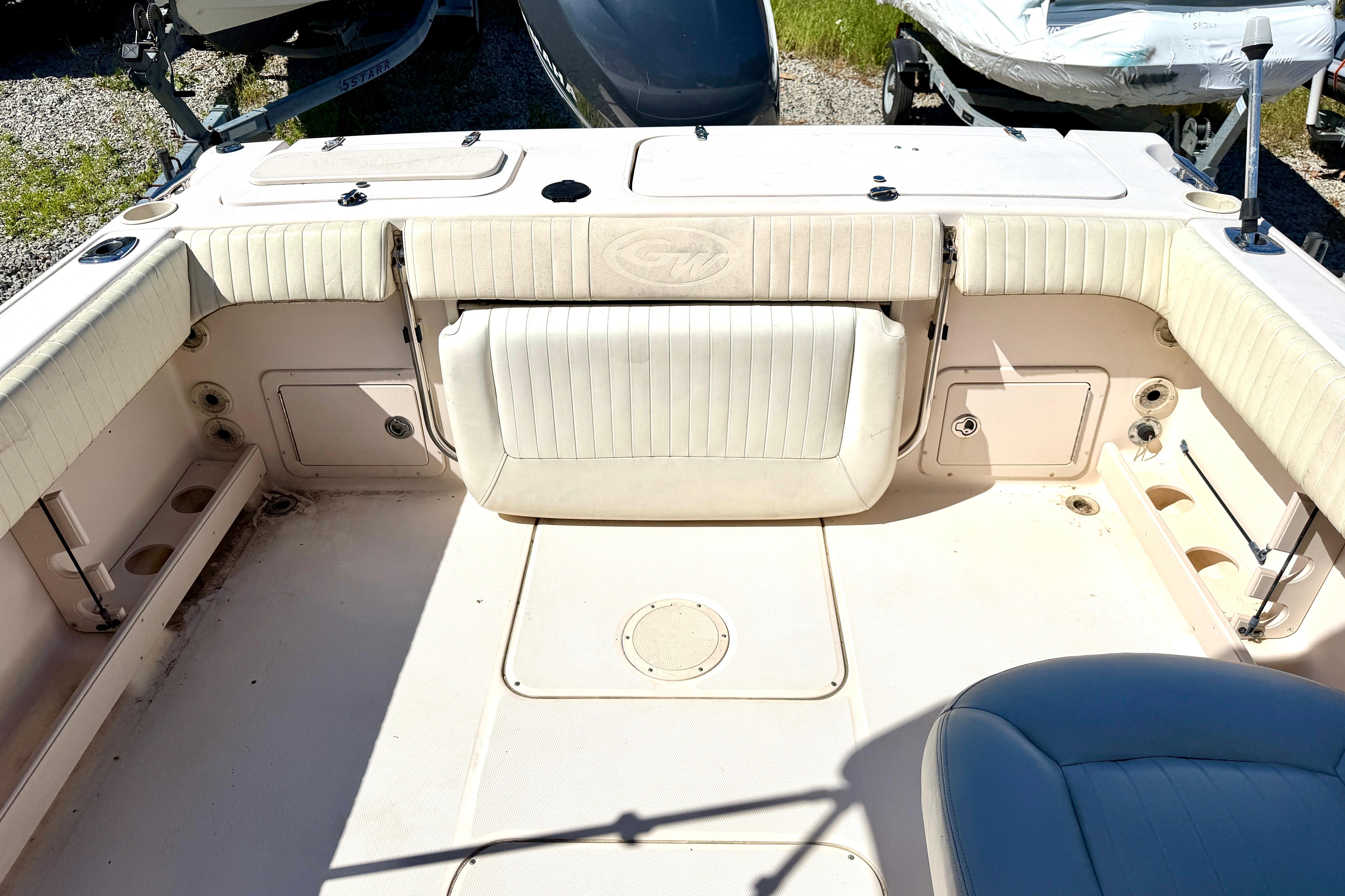 2005 Grady-White Freedom 225 boat interior with cushioned seating and storage compartments.