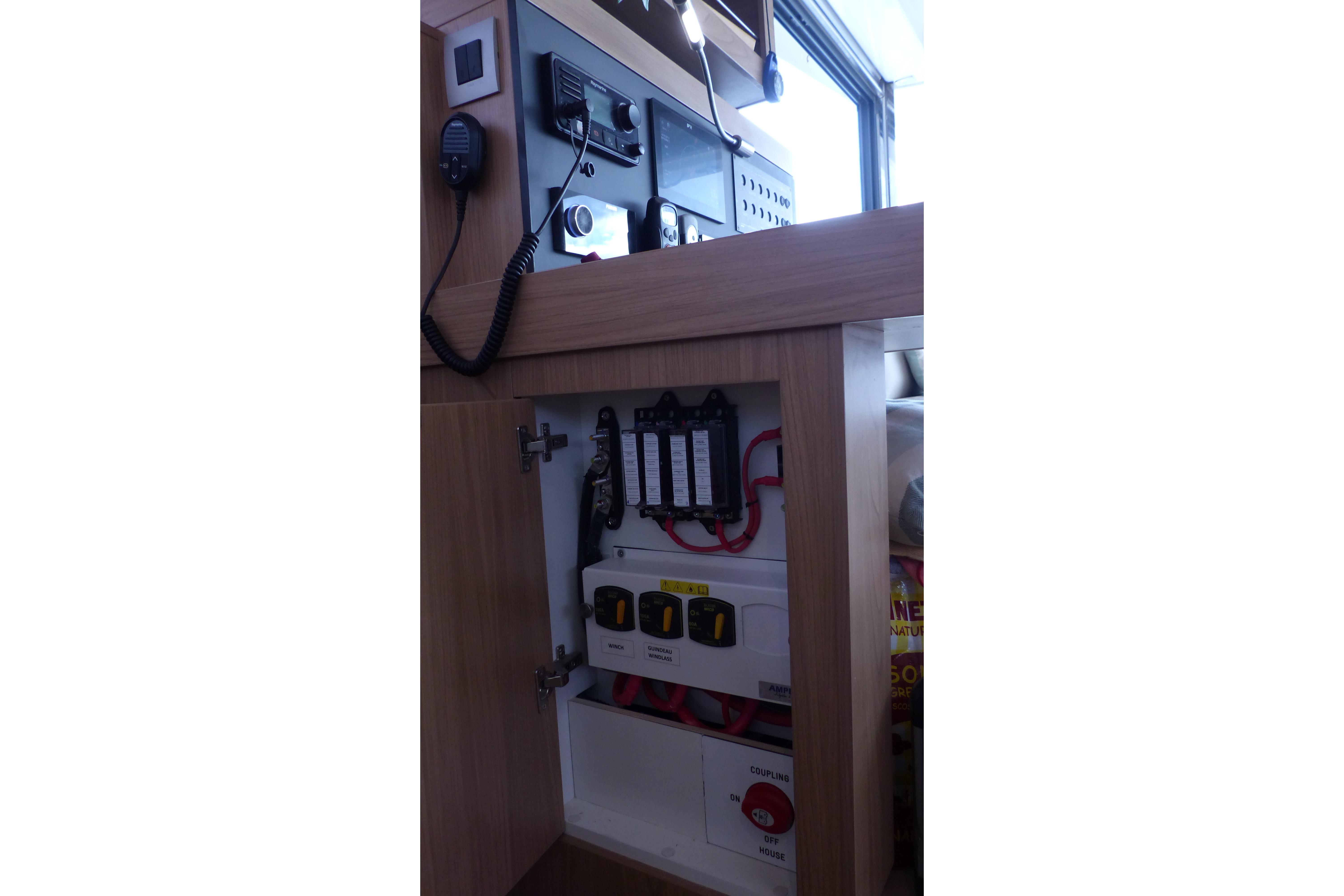Electrical panel inside a 2024 Bali CATSMART yacht, featuring switches and wiring.