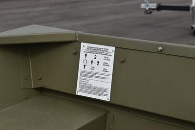 2025 Lowe L1240 Jon boat with instruction label on olive green interior.