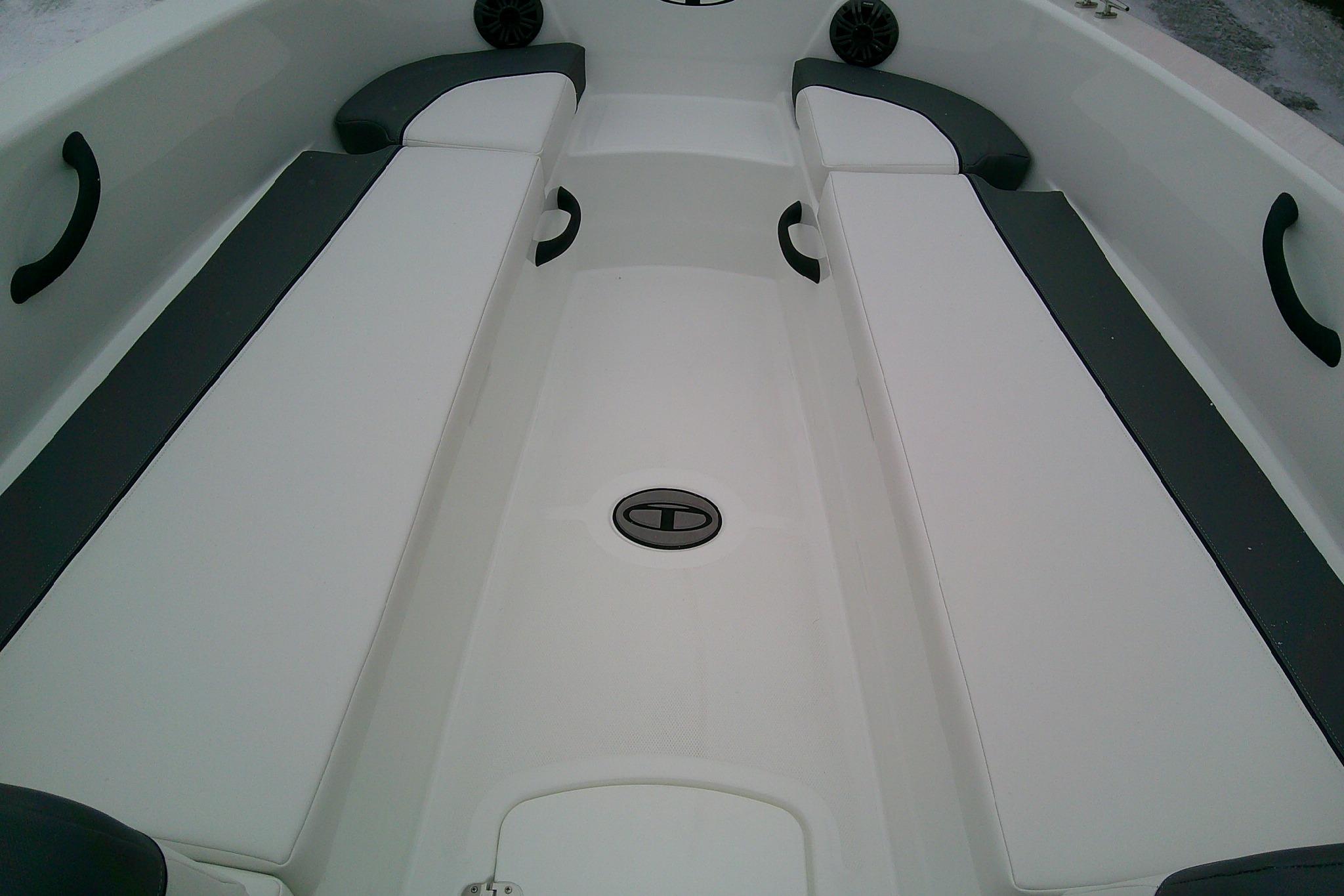 2026 Tahoe T18 boat interior with white and gray seating, featuring sleek design.