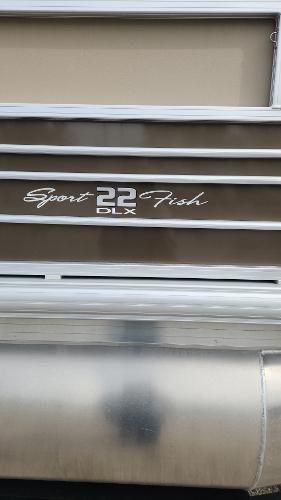 2023 Sun Tracker SportFish 22 DLX pontoon boat exterior.