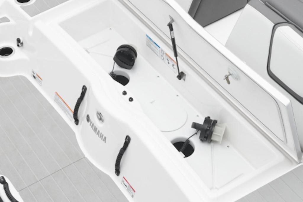 2026 Yamaha Boats SX250 storage compartment with open hatch and visible components.