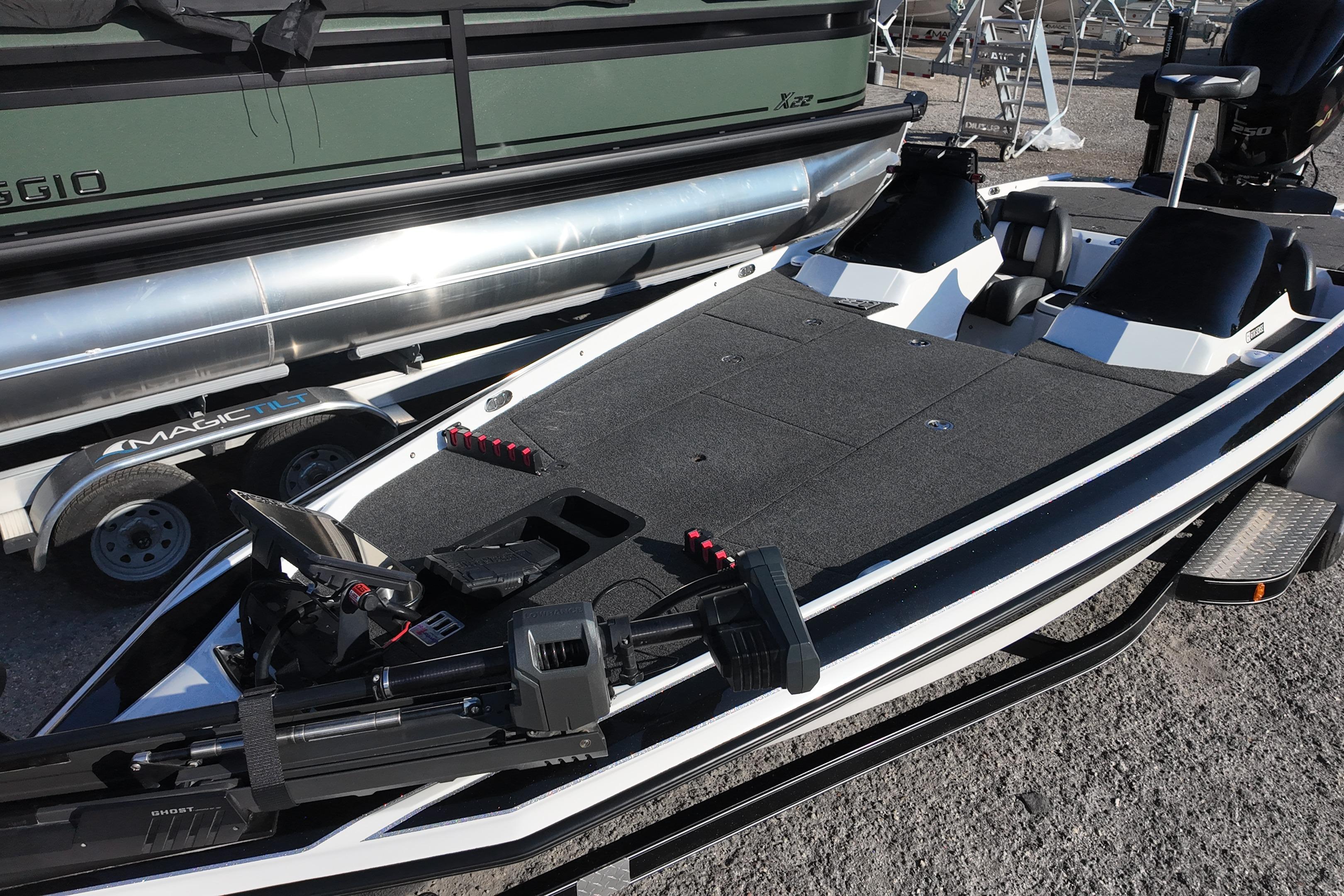 2022 Bullet 21SDC boat with spacious deck, parked on a trailer.