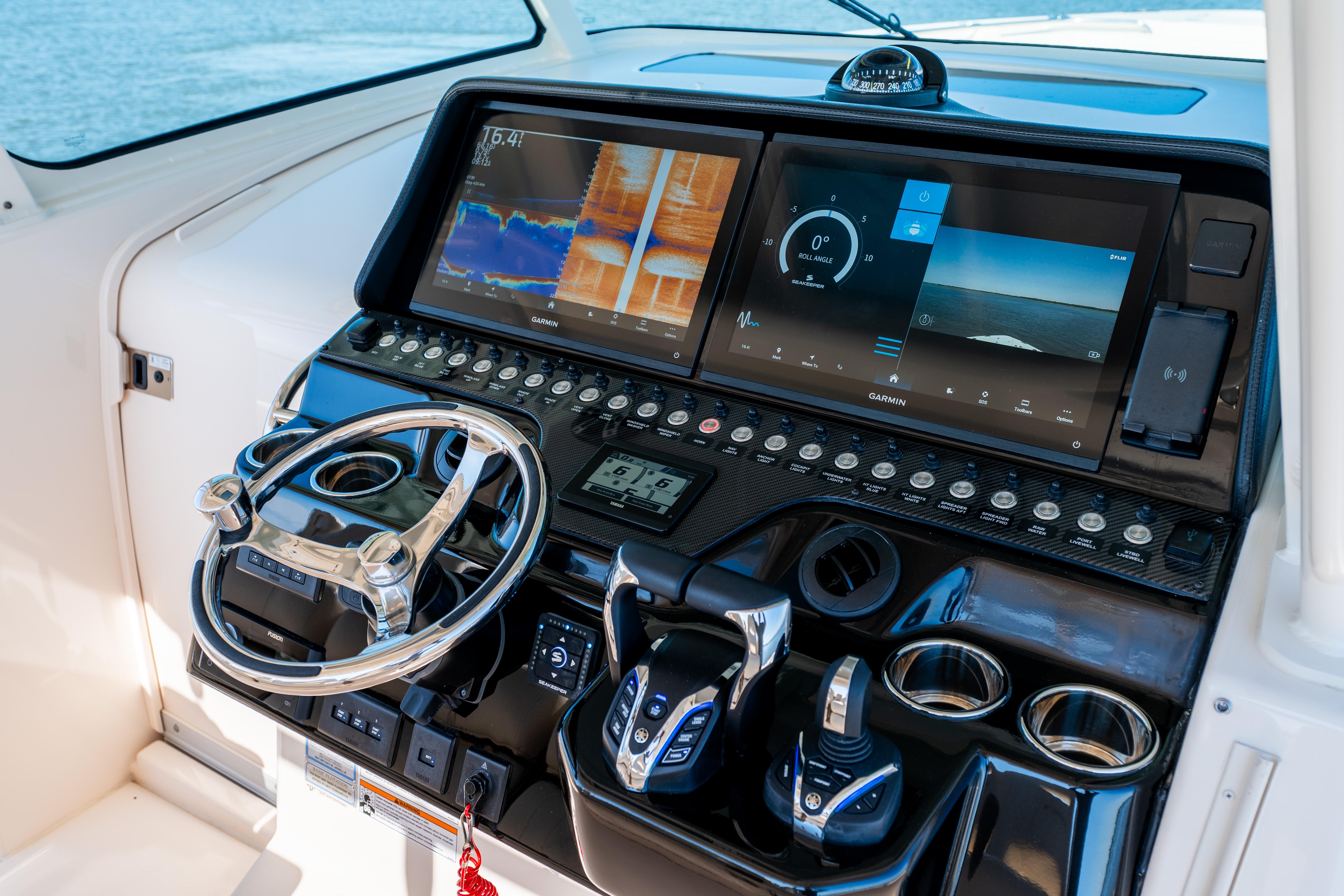Helm of 2025 Grady-White Canyon 386 with advanced navigation displays and controls.