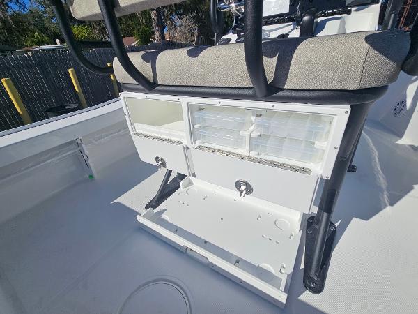 2026 Sea Hunt BX 22 BR boat storage compartments with seating, showcasing organized tackle boxes.