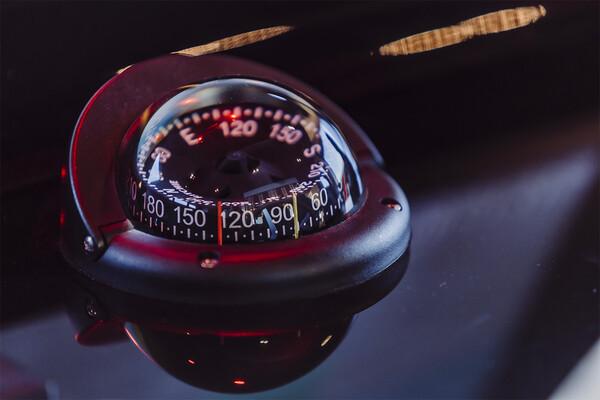 Compass on Cranchi 67 Corsa yacht, 2025 model, with illuminated directional markings.