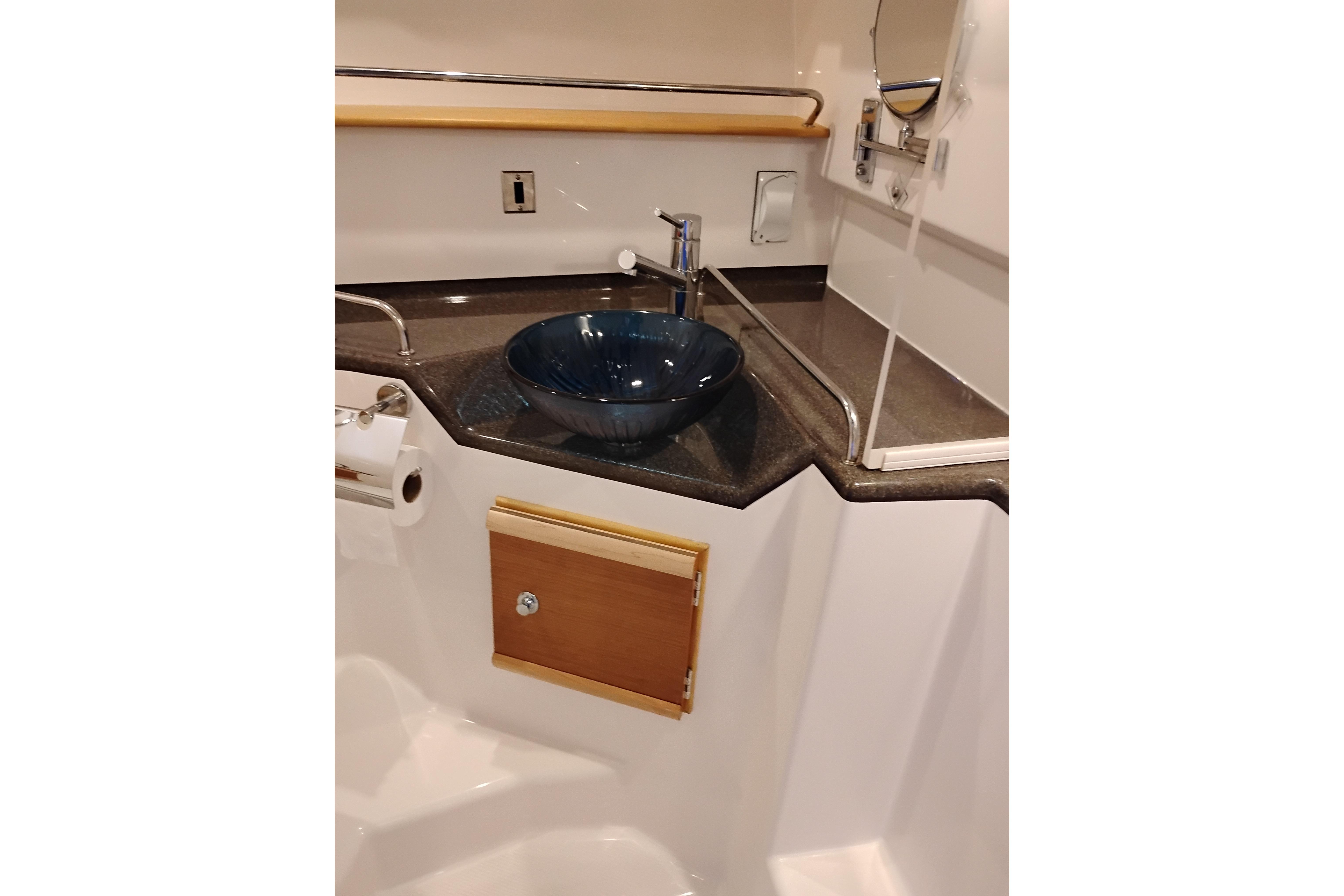 2022 Cutwater C-32 Coupe bathroom with modern sink and sleek countertop design.