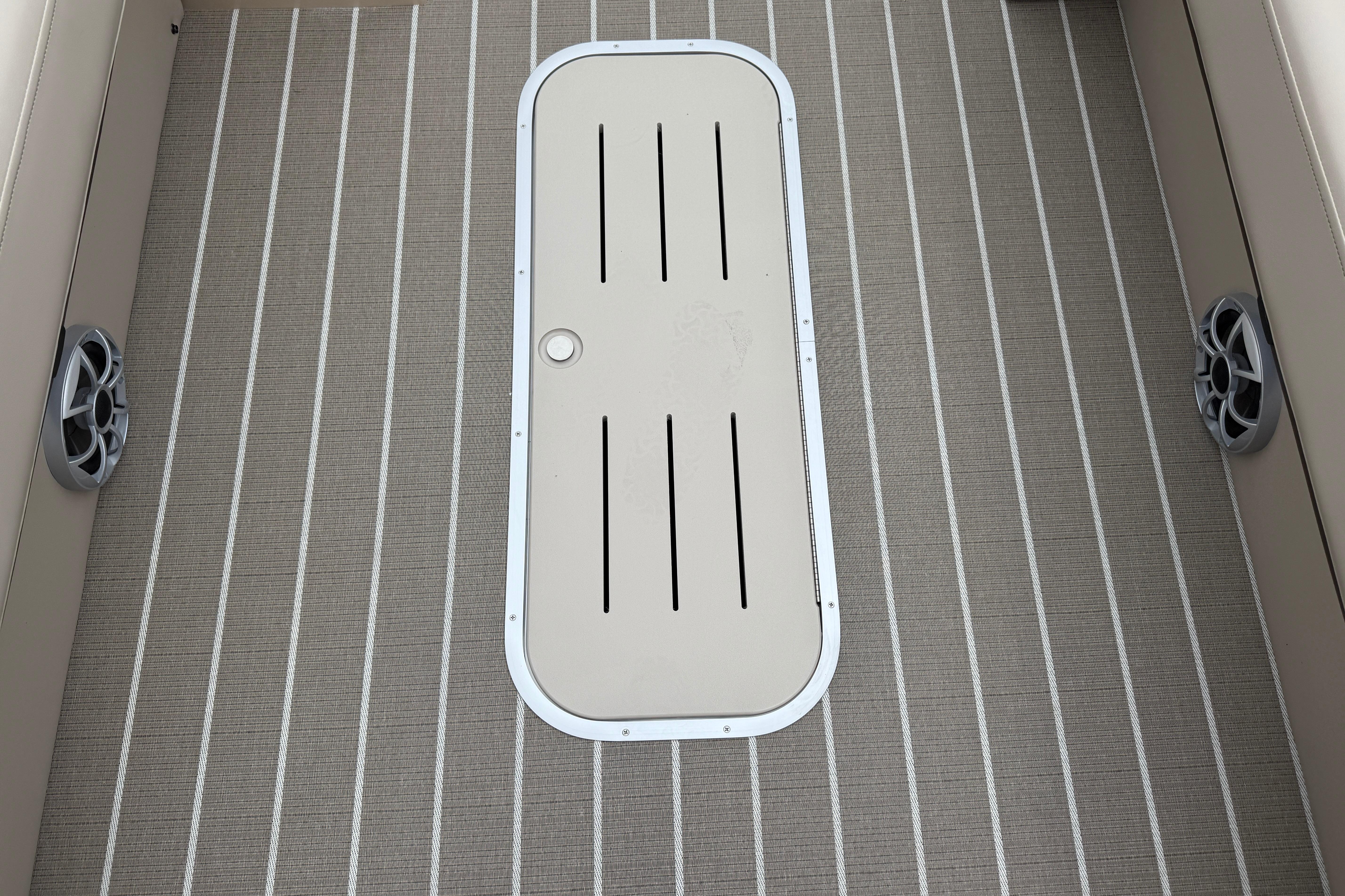 2026 Bentley Pontoons Elite 253 Admiral deck with striped flooring and speaker details.