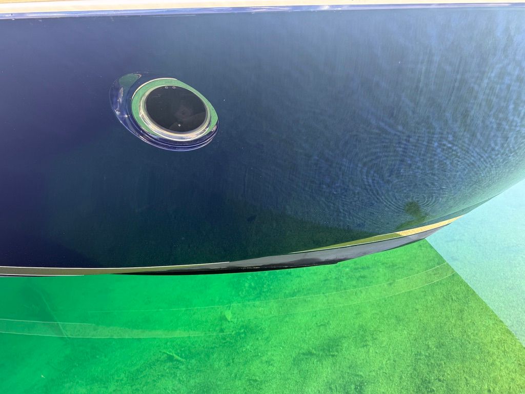 Close-up of the hull of a 2017 Tiara Yachts C44 Coupe in the water.