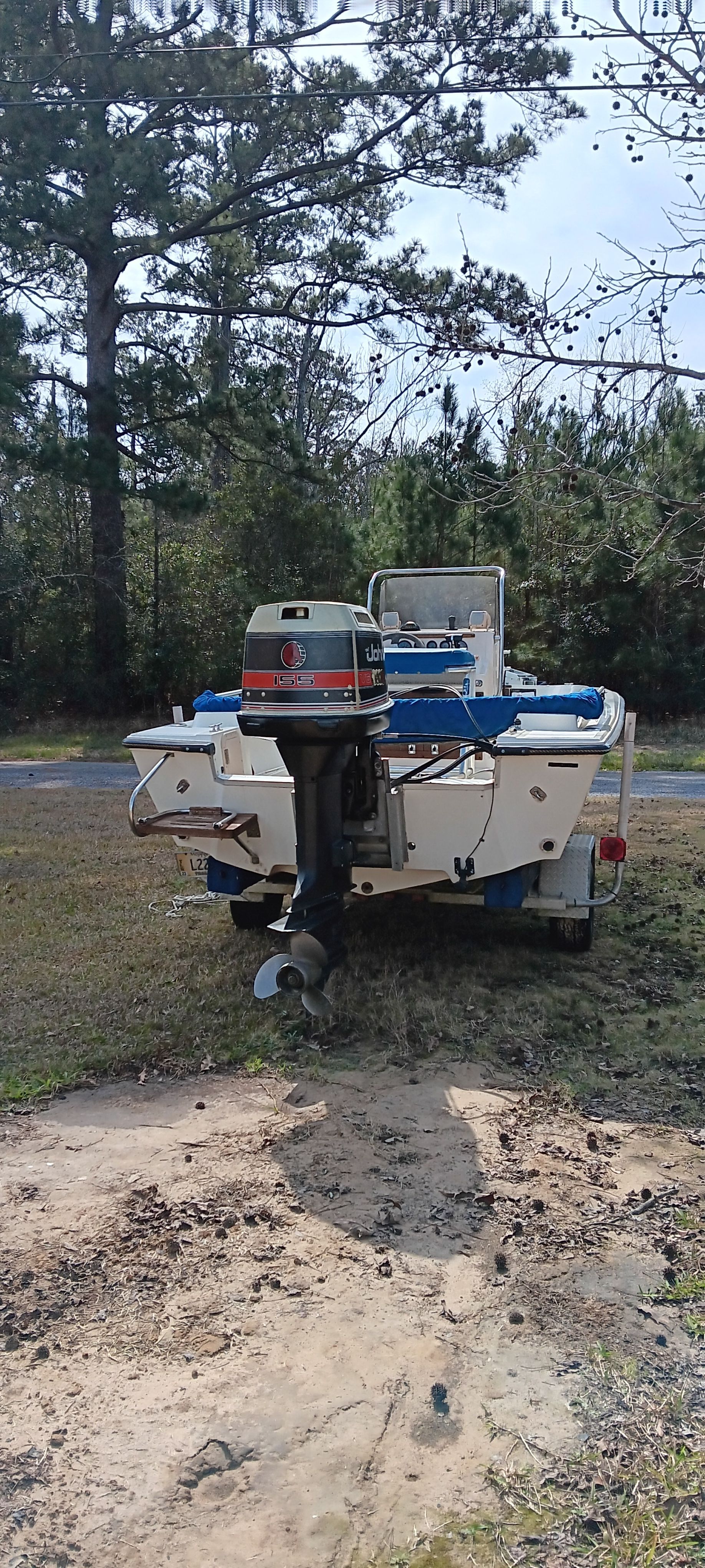 A 1990 Hydra-Sports Vector on a trailer, set on grassy ground.