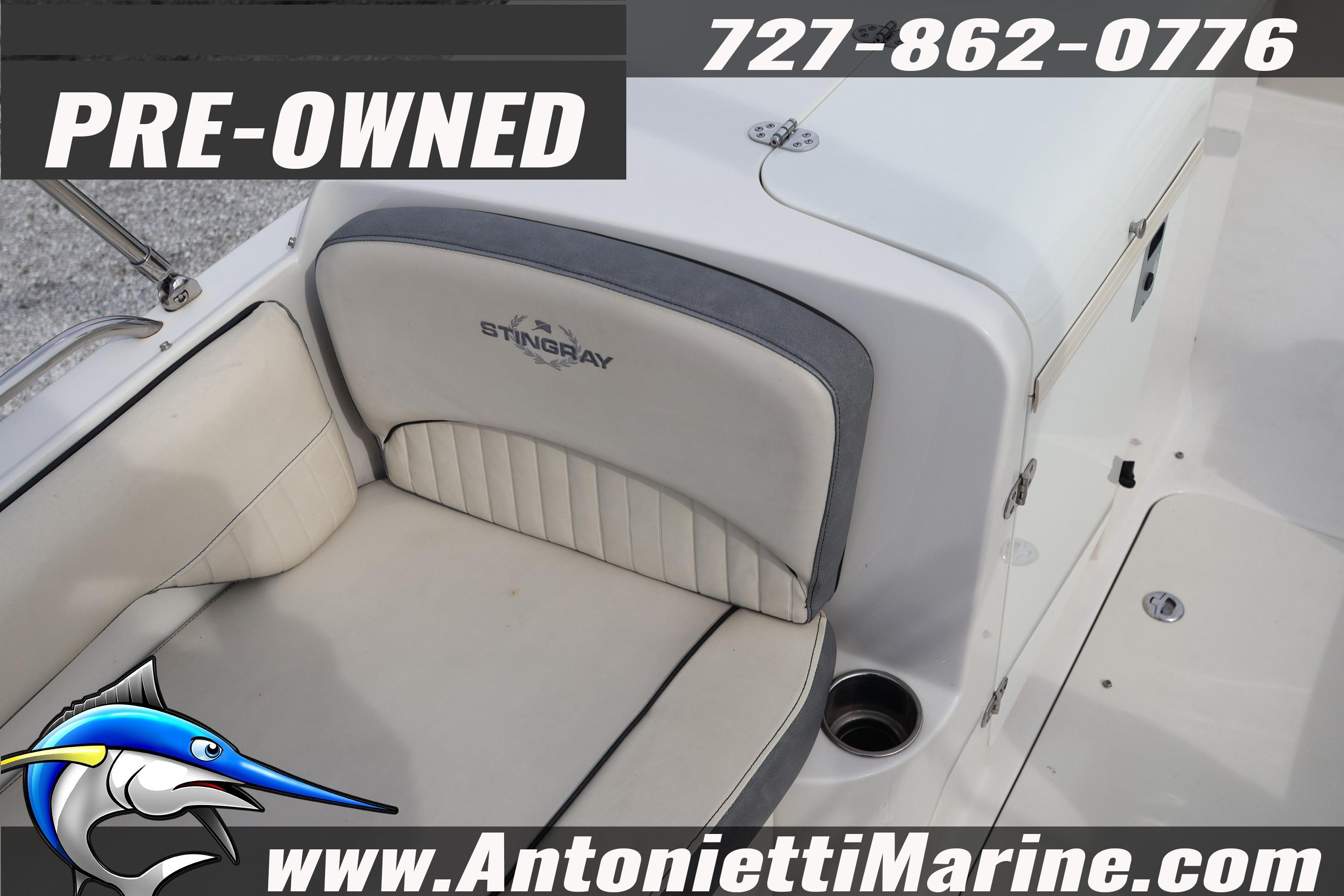 Pre-owned 2023 Stingray 212 SC boat interior with seating, Antonietti Marine contact details.