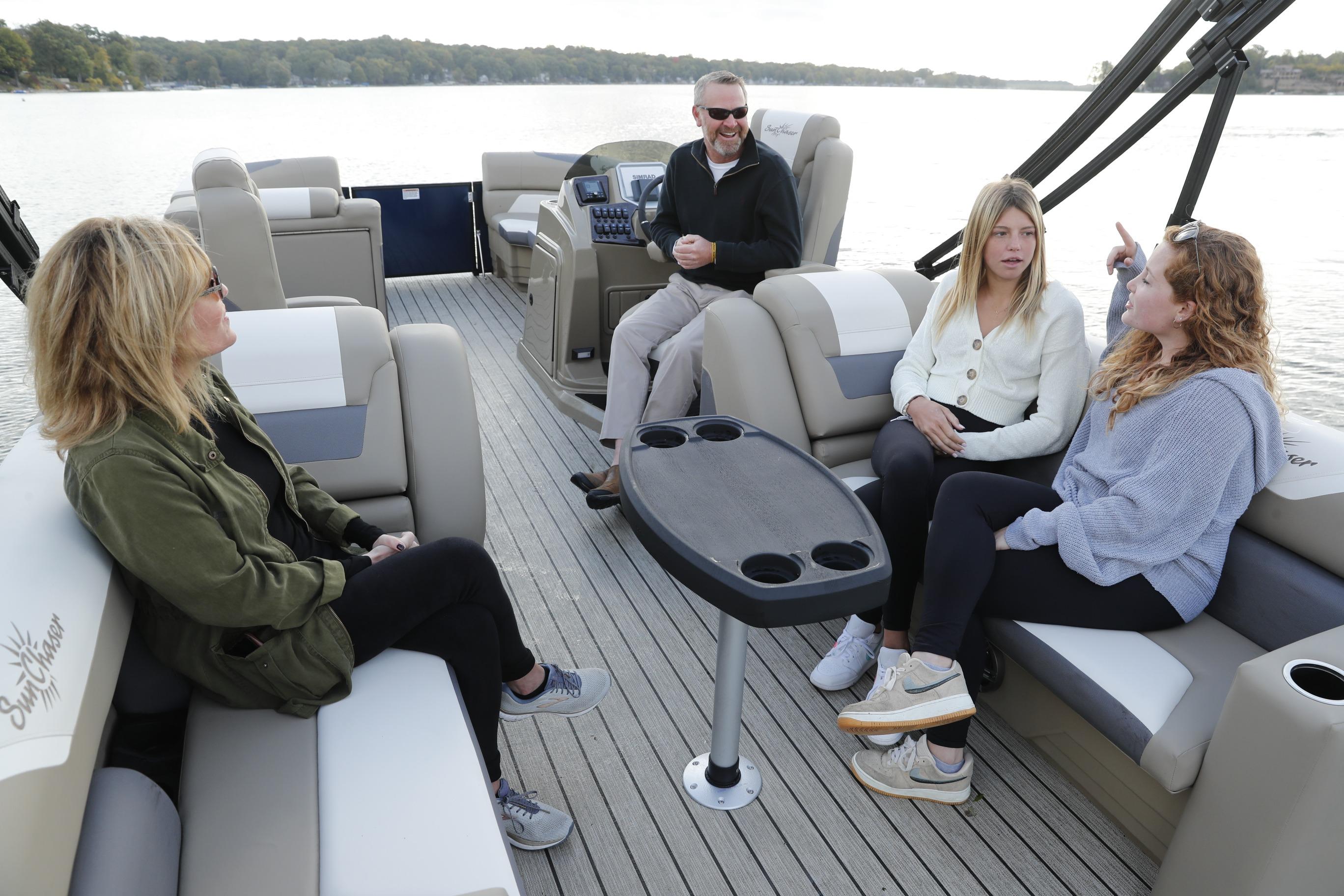 Group enjoying a ride on the 2026 SunChaser Eclipse 25 LR DH pontoon boat.