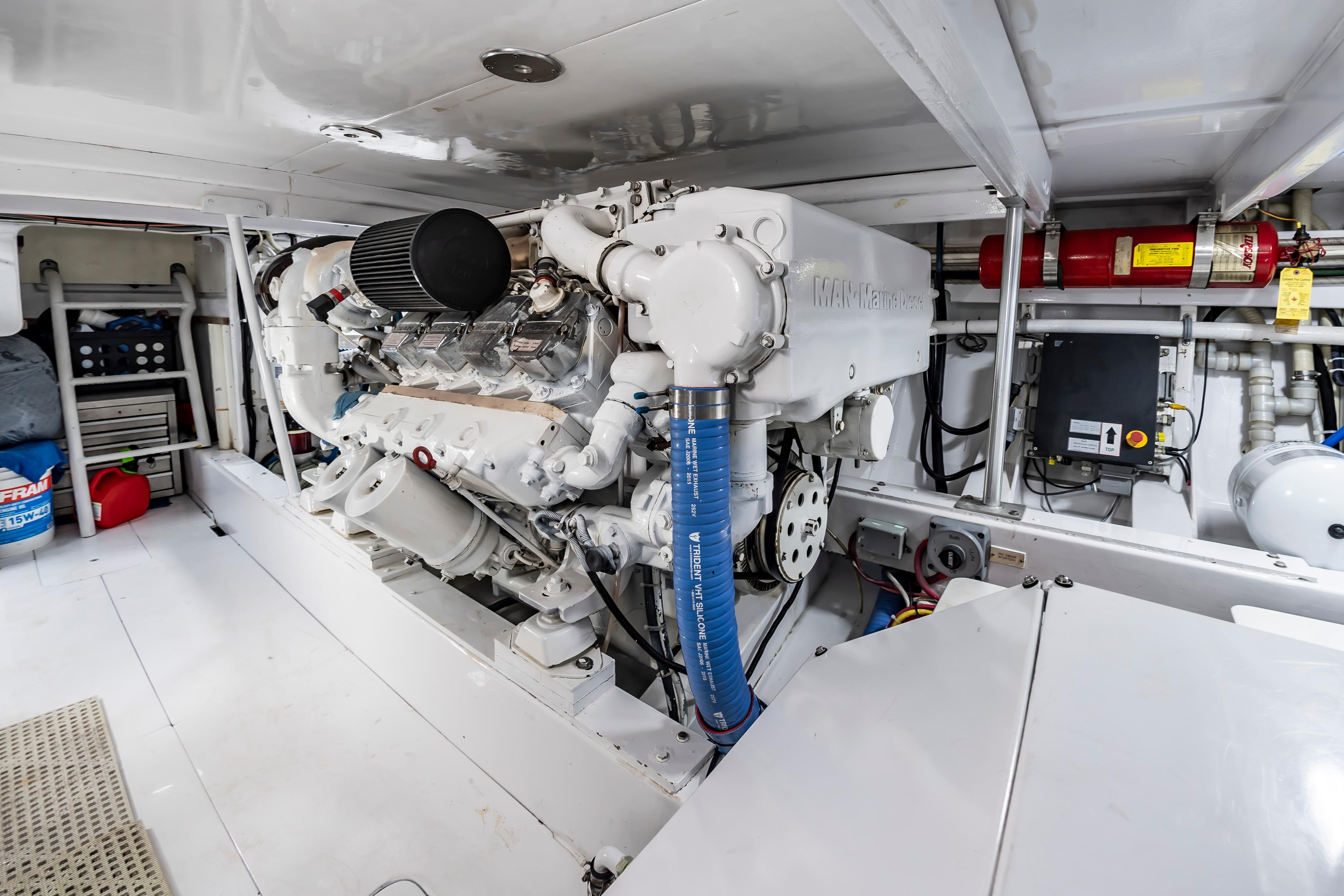 Engine room of 1993 Custom Carolina Scarborough 56 Convertible, featuring a MAN marine engine.