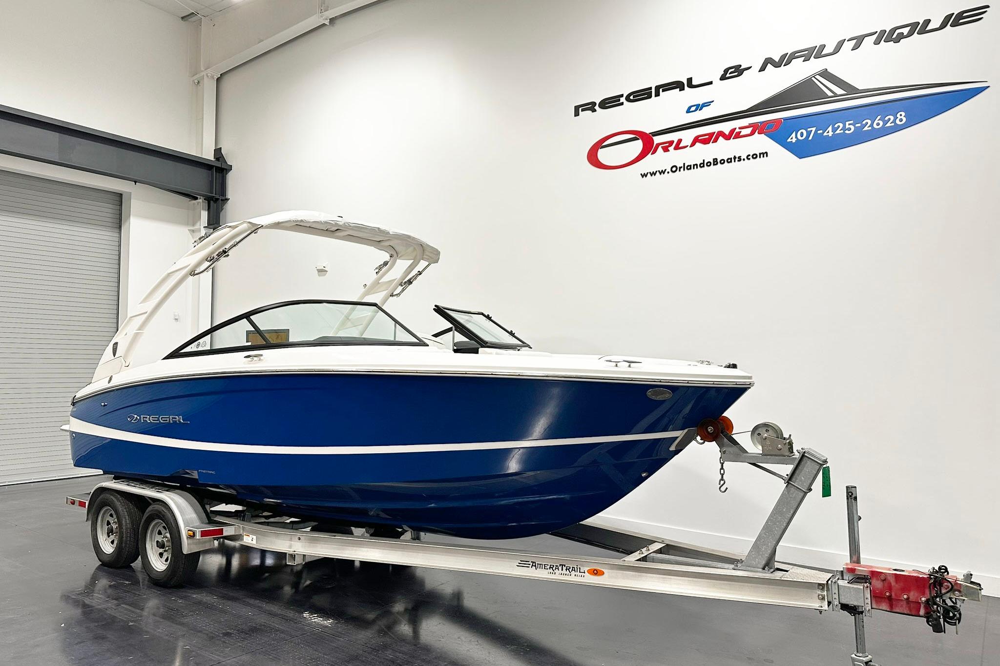 2025 Regal LS2 boat on trailer in showroom, Orlando dealership.