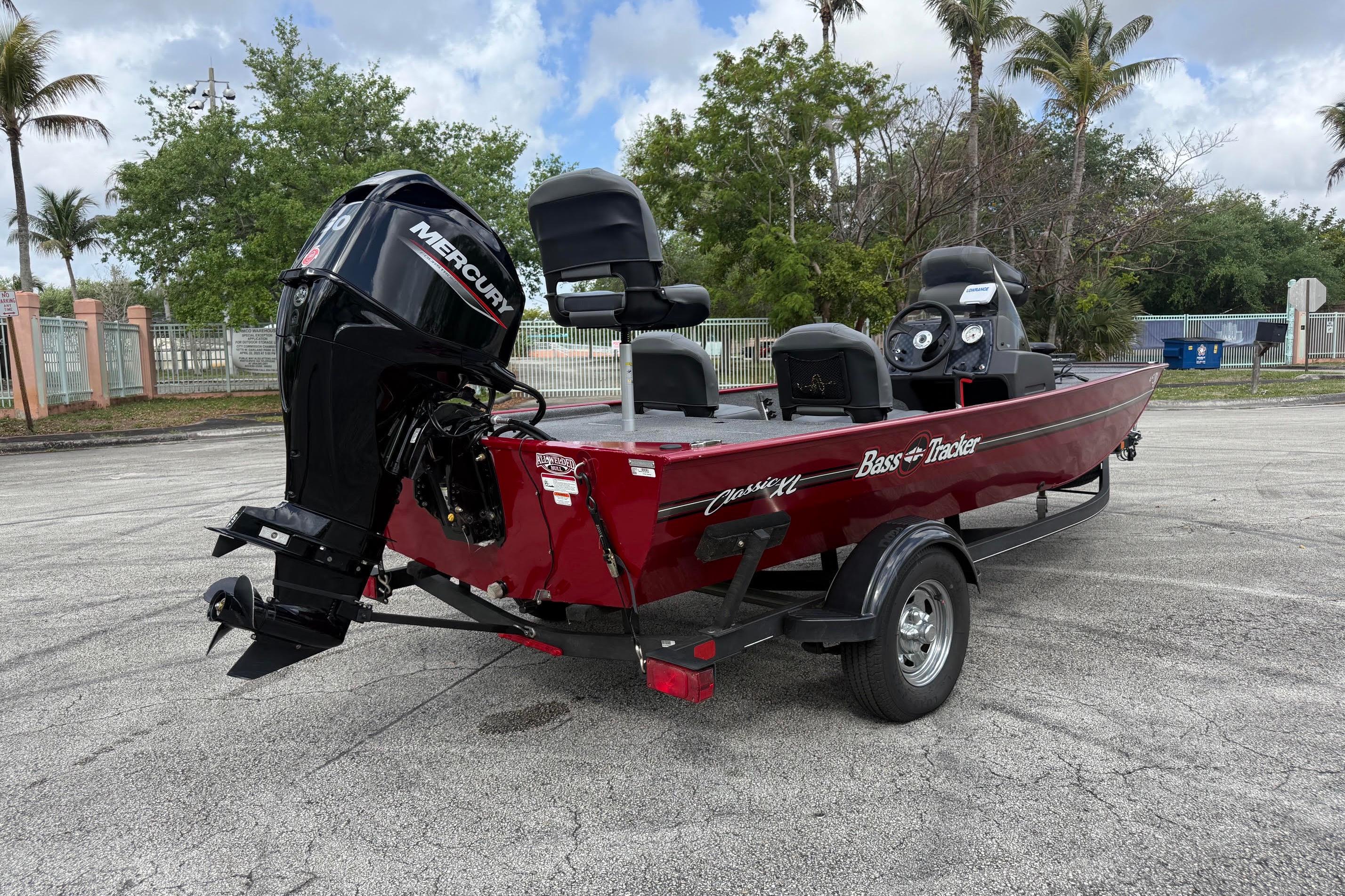 2023 Bass Tracker III Classic boat with Mercury engine, parked outdoors on a trailer.