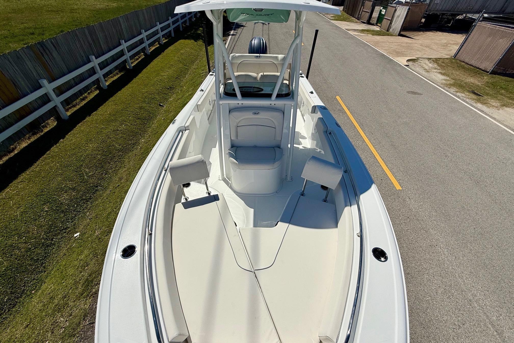 2026 Sea Hunt Ultra 229 boat, top view, parked on a road.