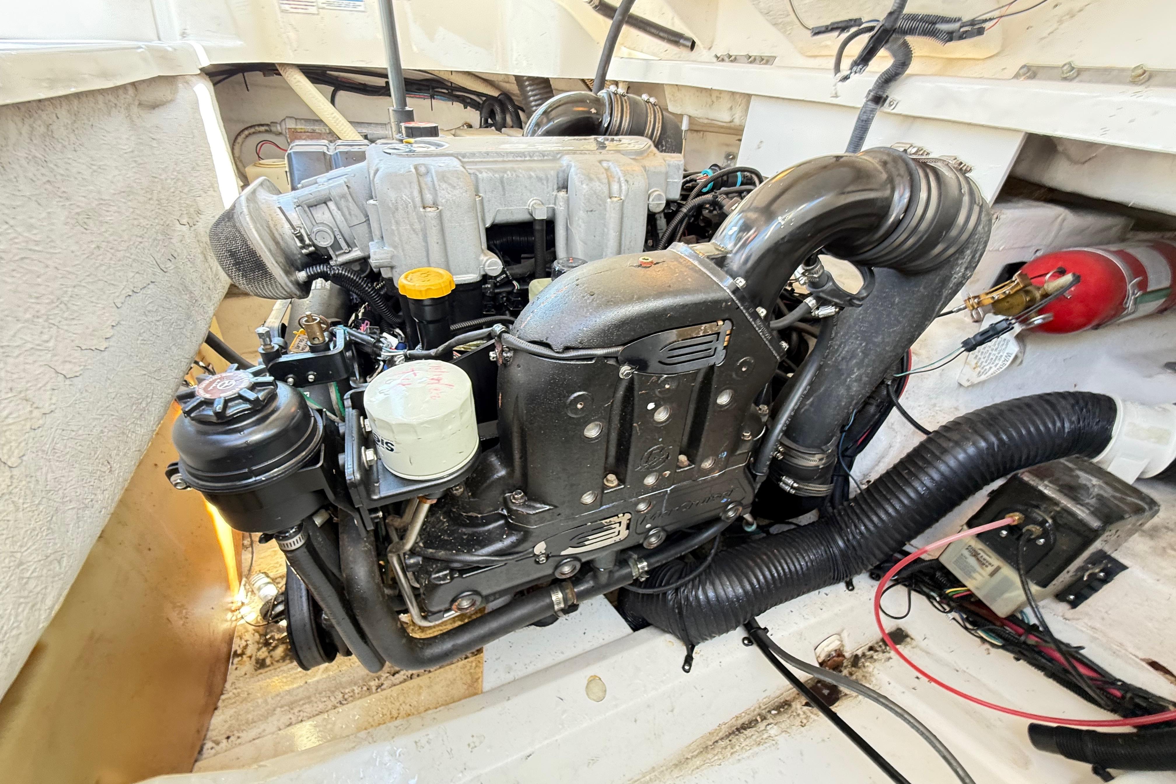 Engine compartment of a 2011 Sea Ray 270 SLX boat, showcasing detailed components.