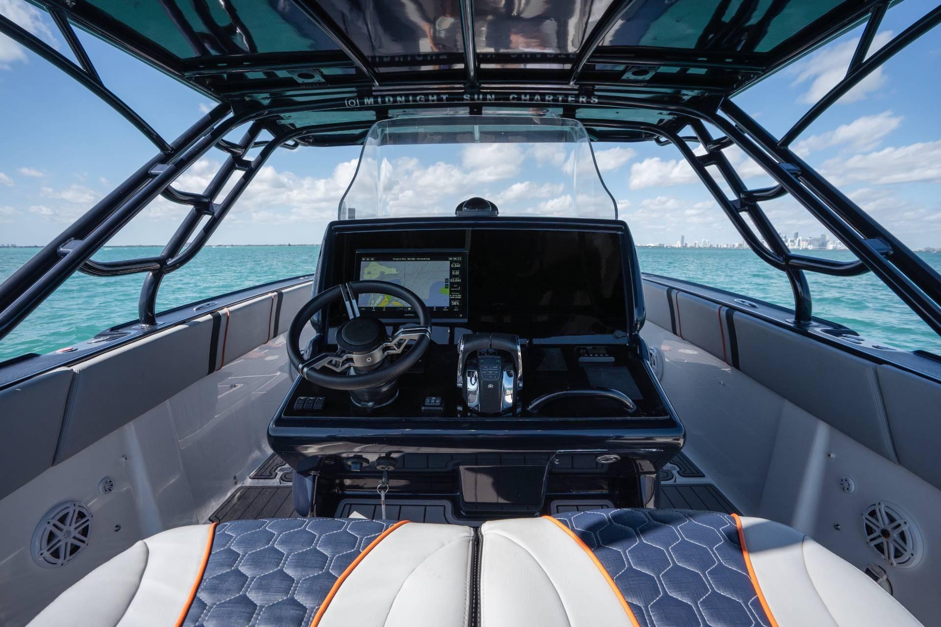 Cockpit view of 2014 Midnight Express 37 Open boat on the ocean.