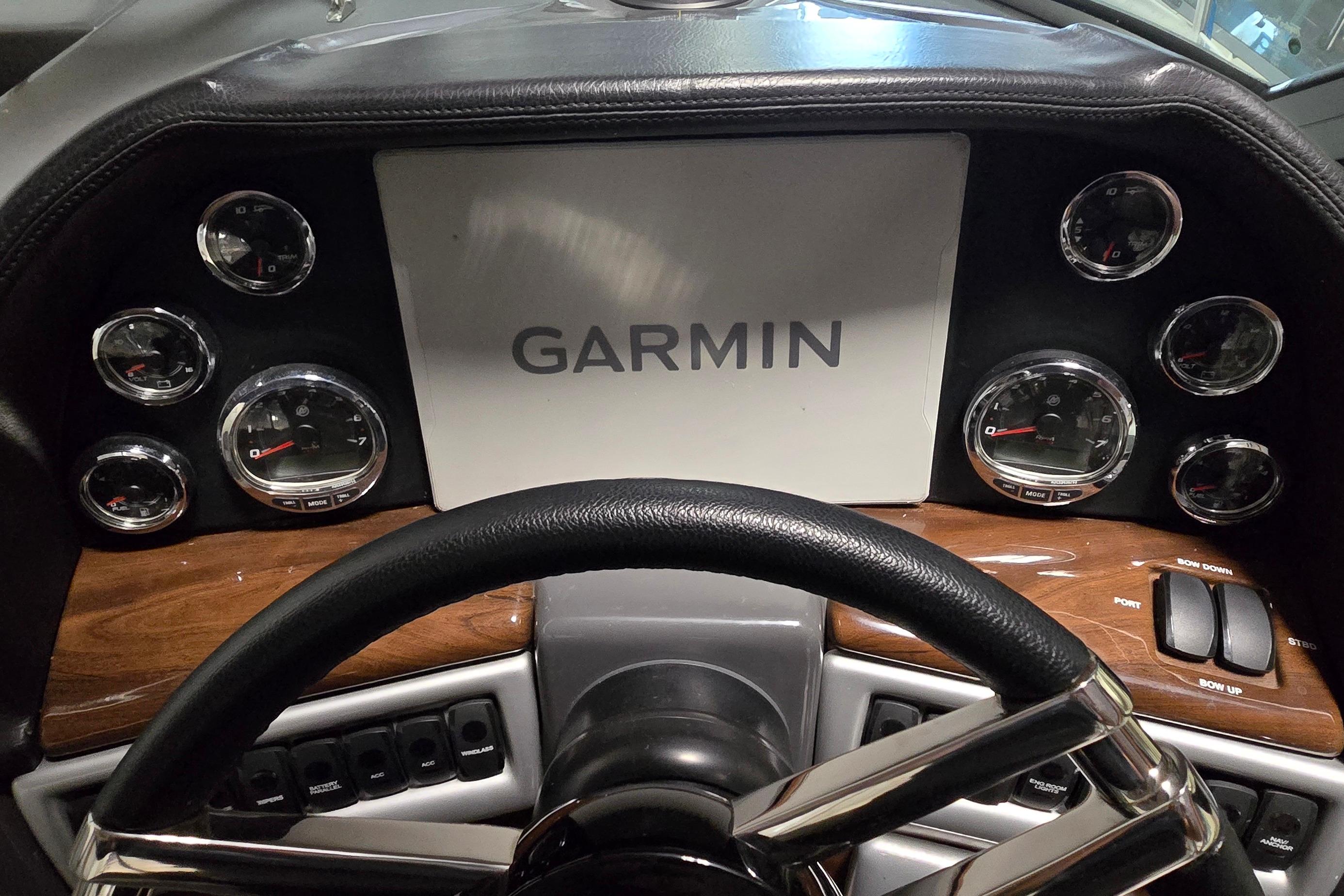 Dashboard of 2018 Four Winns V355 boat with Garmin display and gauges.