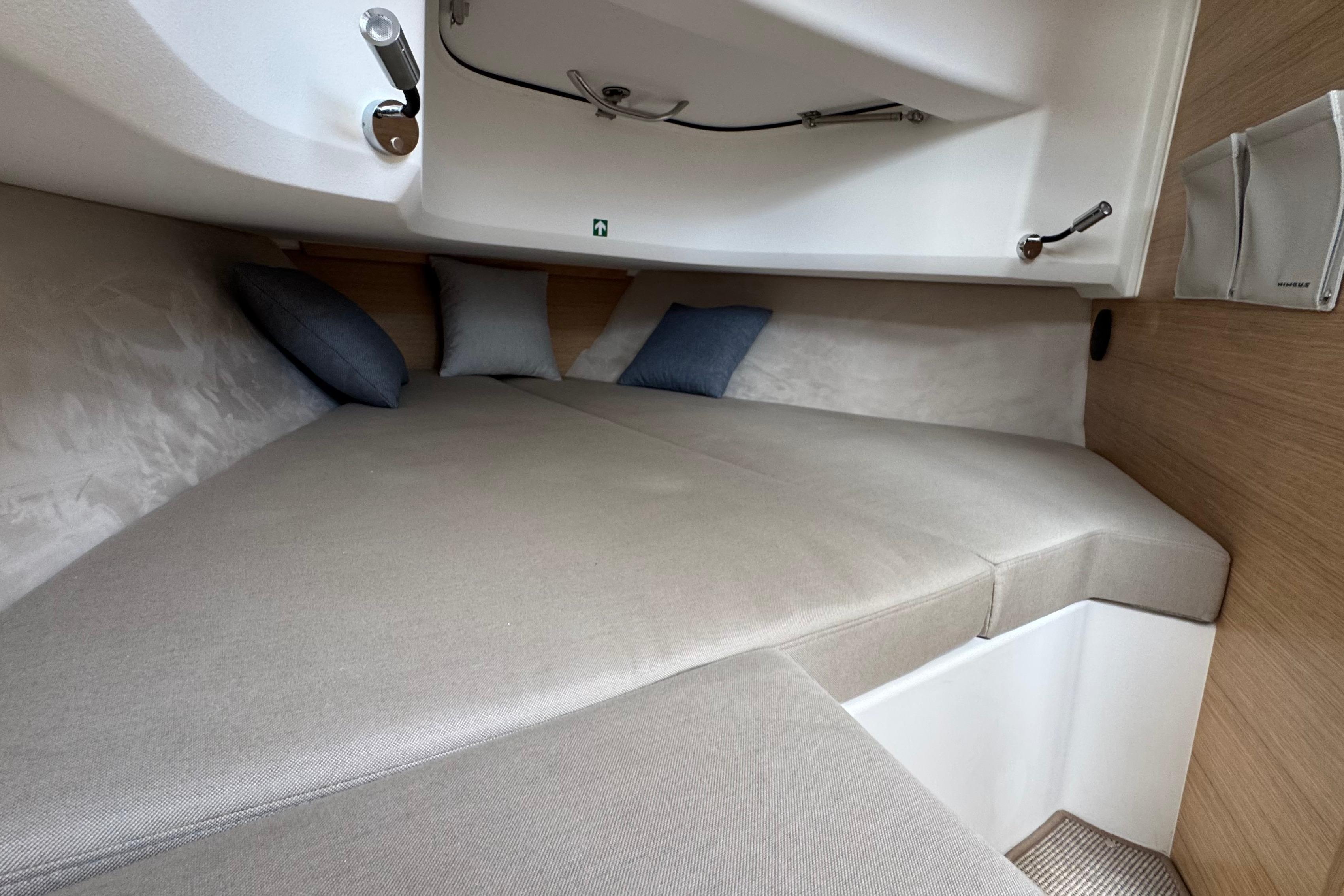 Interior of the 2026 Nimbus Commuter 9 with comfortable cushions and pillows.