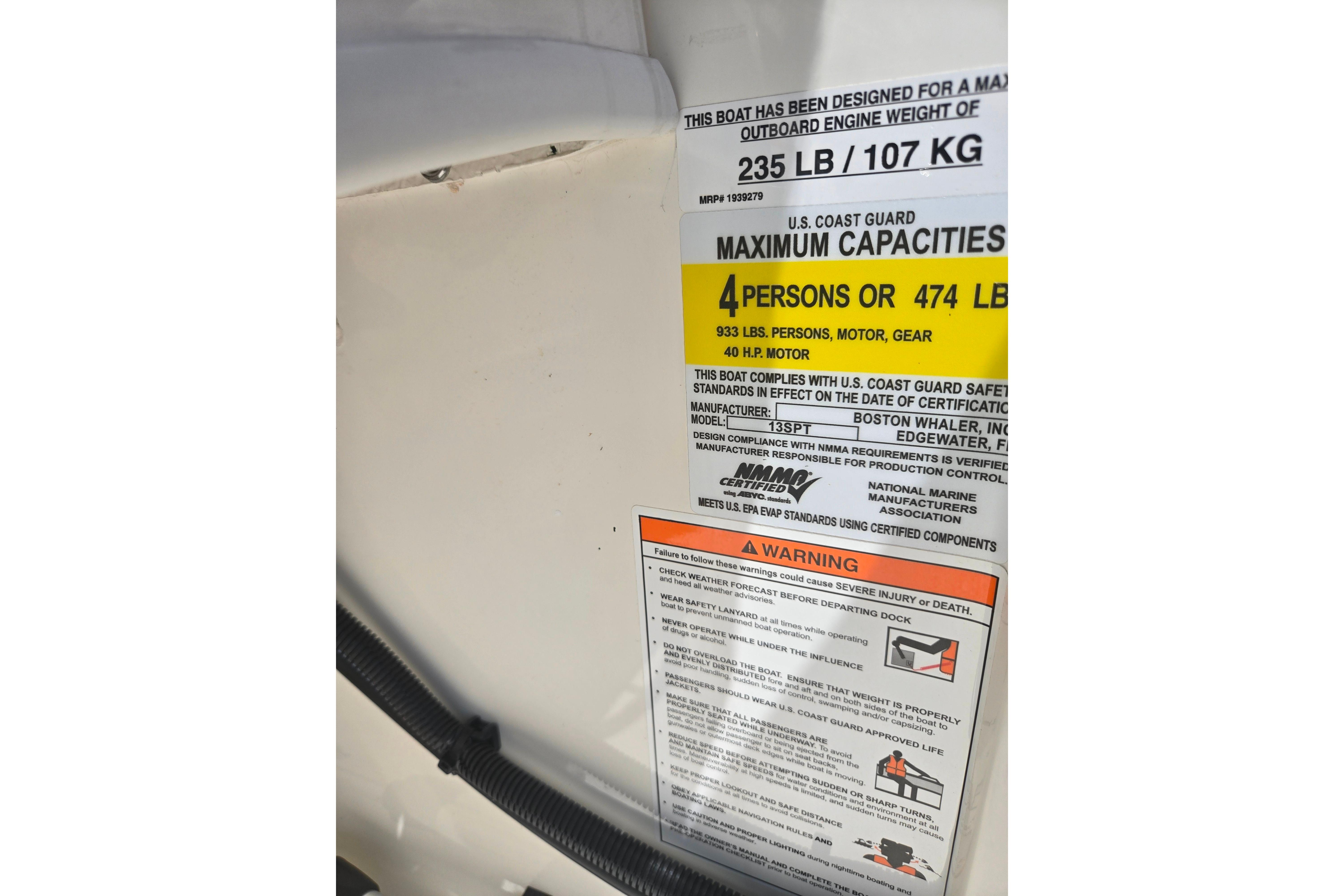 2025 Boston Whaler 130 Super Sport capacity label detailing weight and passenger limits.